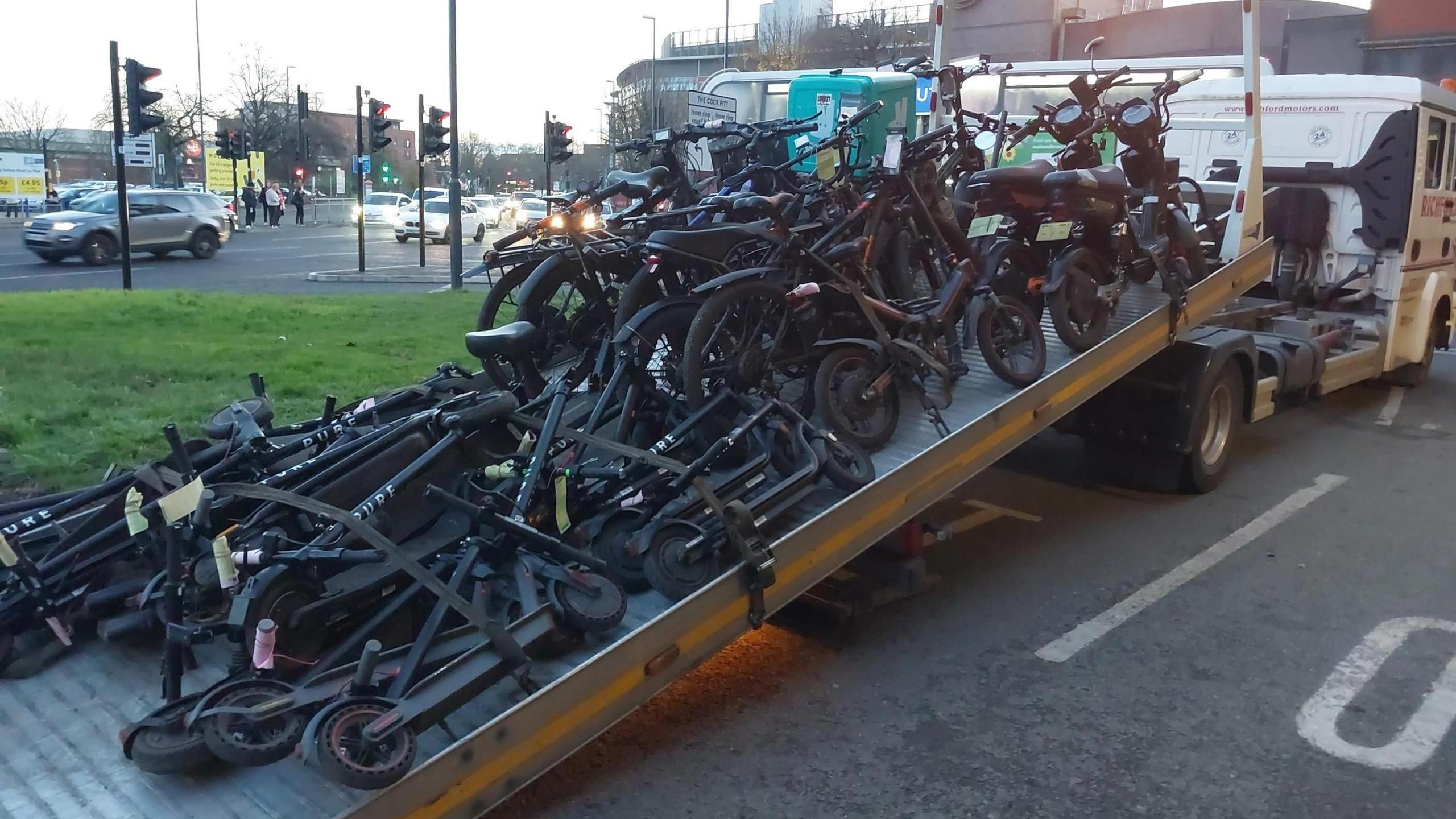 Thirty-nine e-scooters and e-bikes from the Derby operation on a recovery lorry