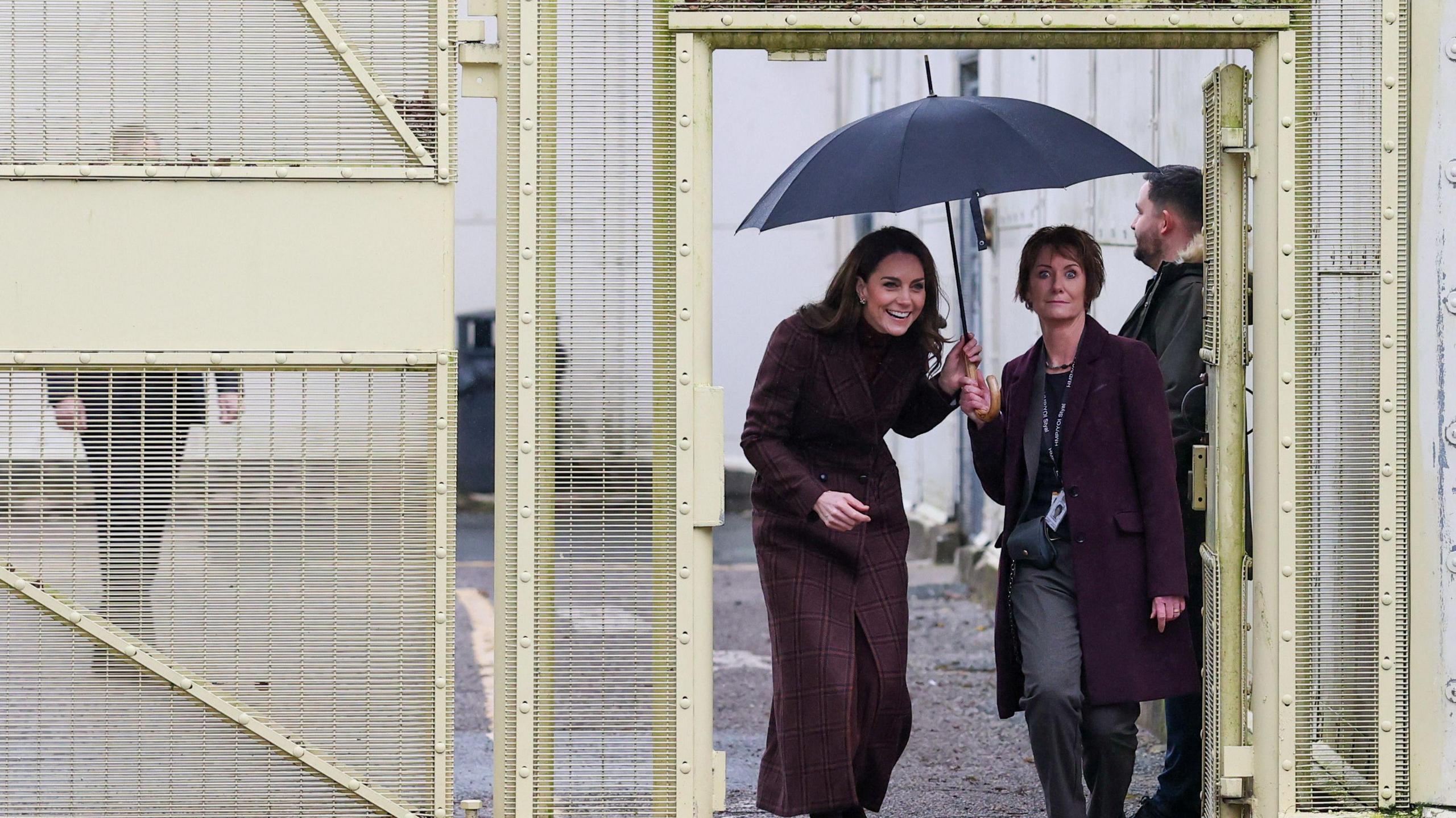 The Princess of Wales was escorted inside the gates of HMP Styal in Cheshire, sheltering under an umbrella.