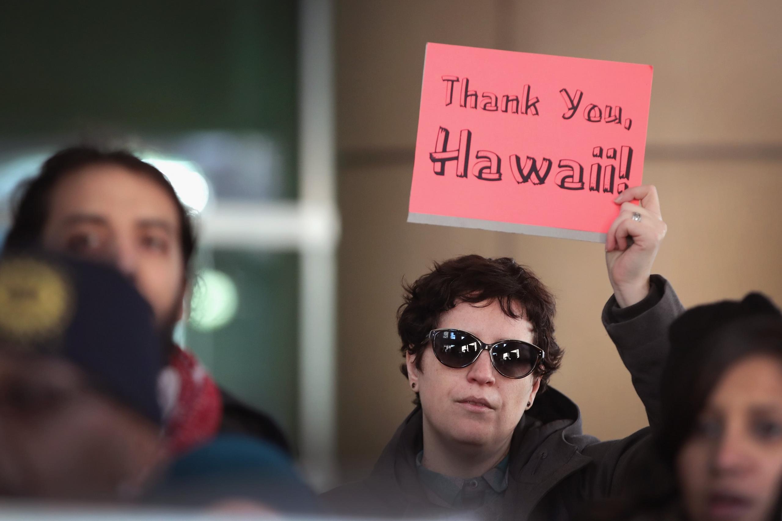 Rachel Weaver protests with other demonstrators outside the office of Immigration and Customs Enforcement (ICE) on March 16, 2017 in Chicago, Illinois.