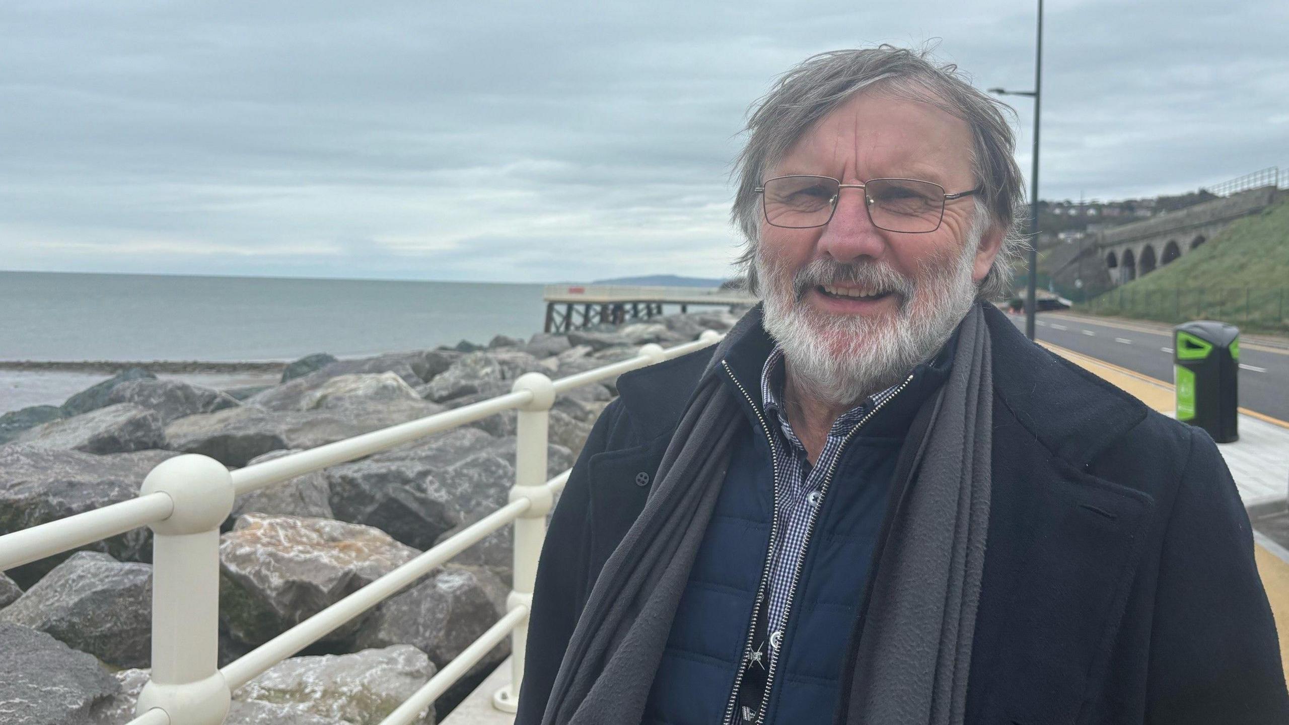 Councillor Goronwy Edwards at the sea defences