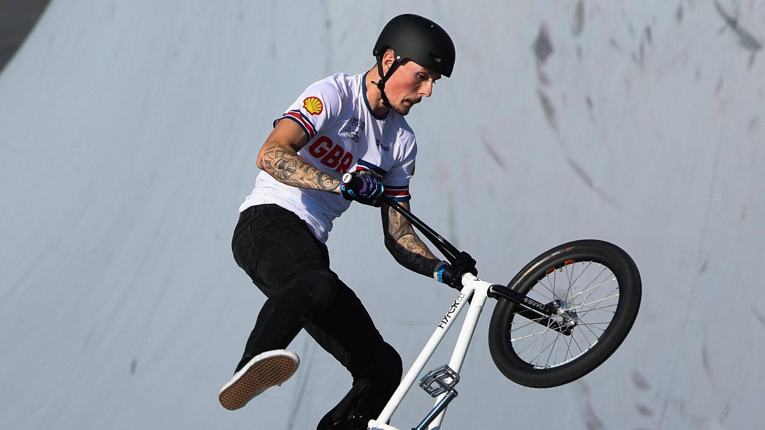 Dylan Hessey performs a trick on his BMX bike