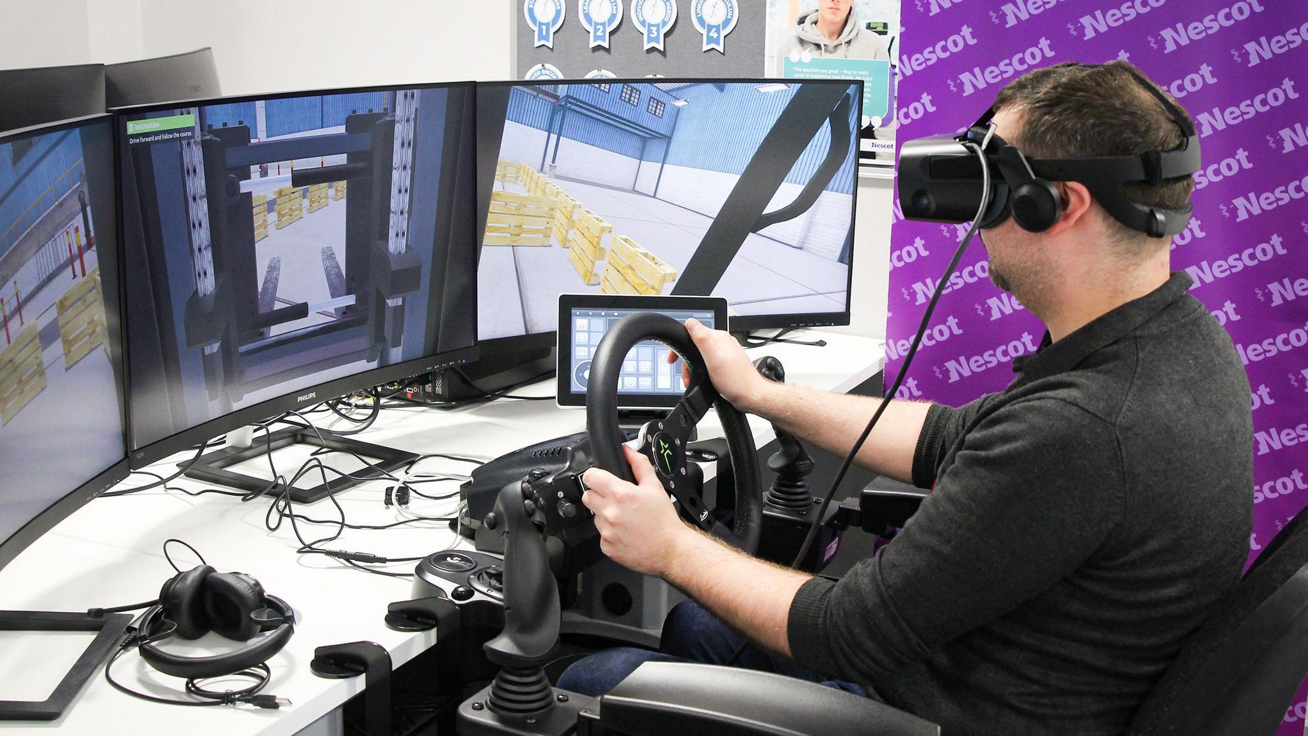 A person with a VR headset on driving a simulated forklift