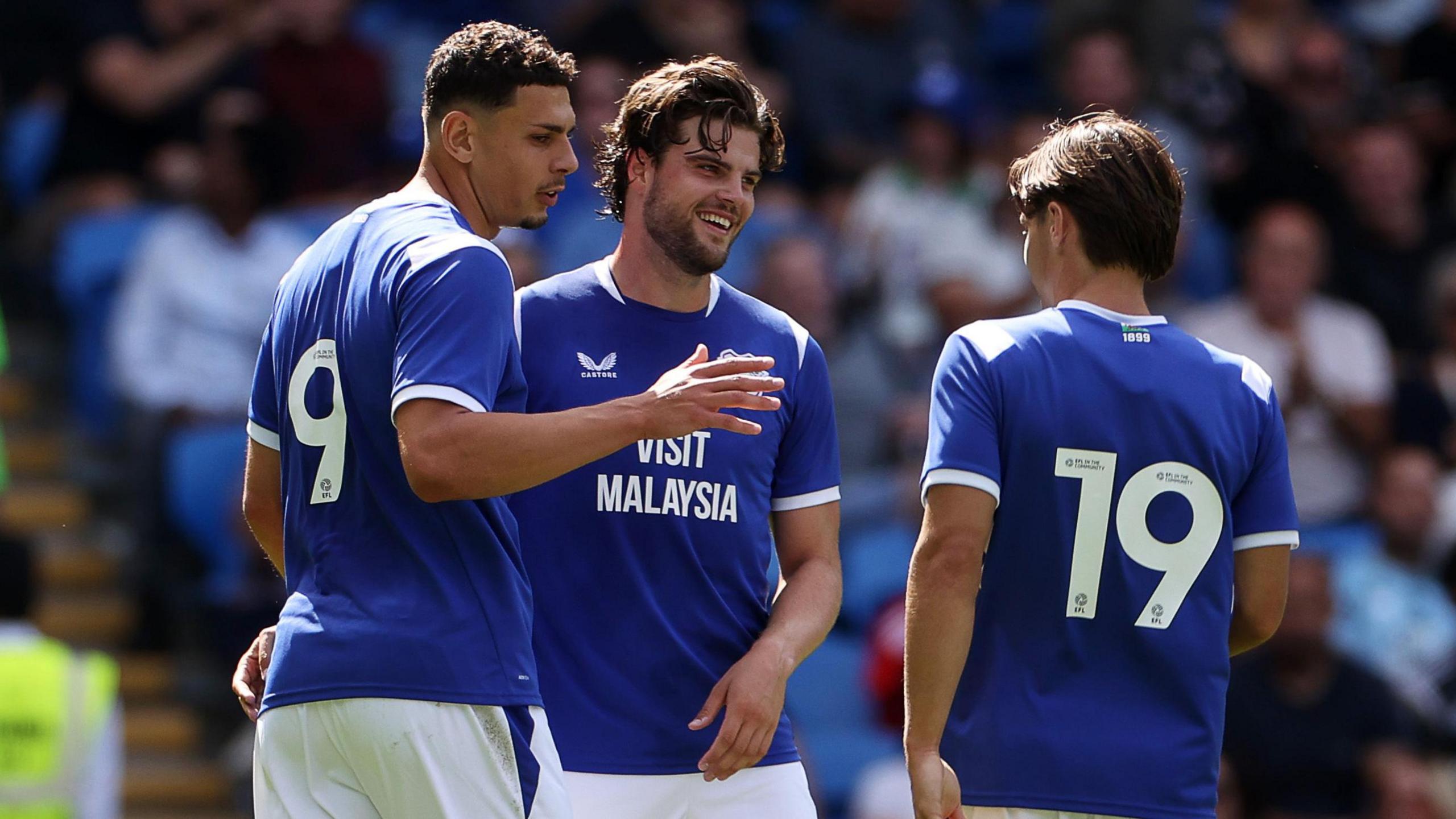 Striker Yousef Salech (left) celebrates with Ollie Tanner (centre) after scoring Cardiff's second goal in their 4-1 pre-season win against Italian giants AS Roma