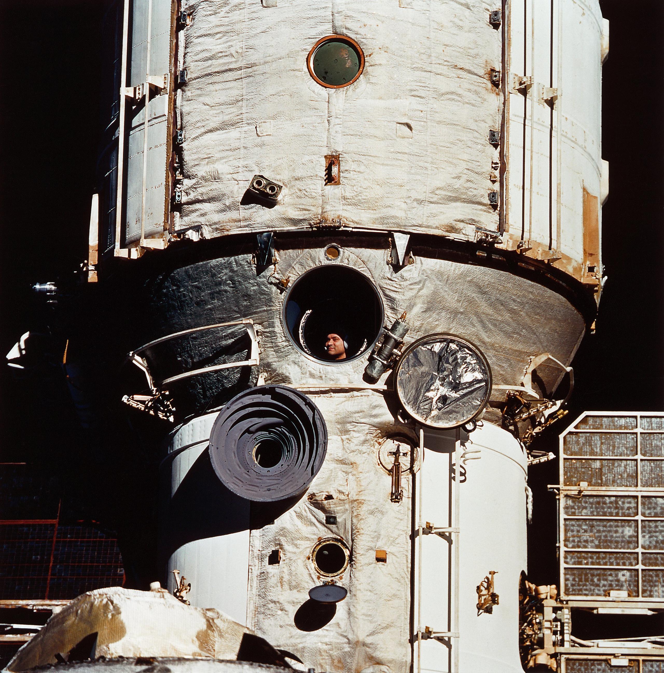 Cosmonaut Valeri Polykov looks out the window of the Russian space station Mir.