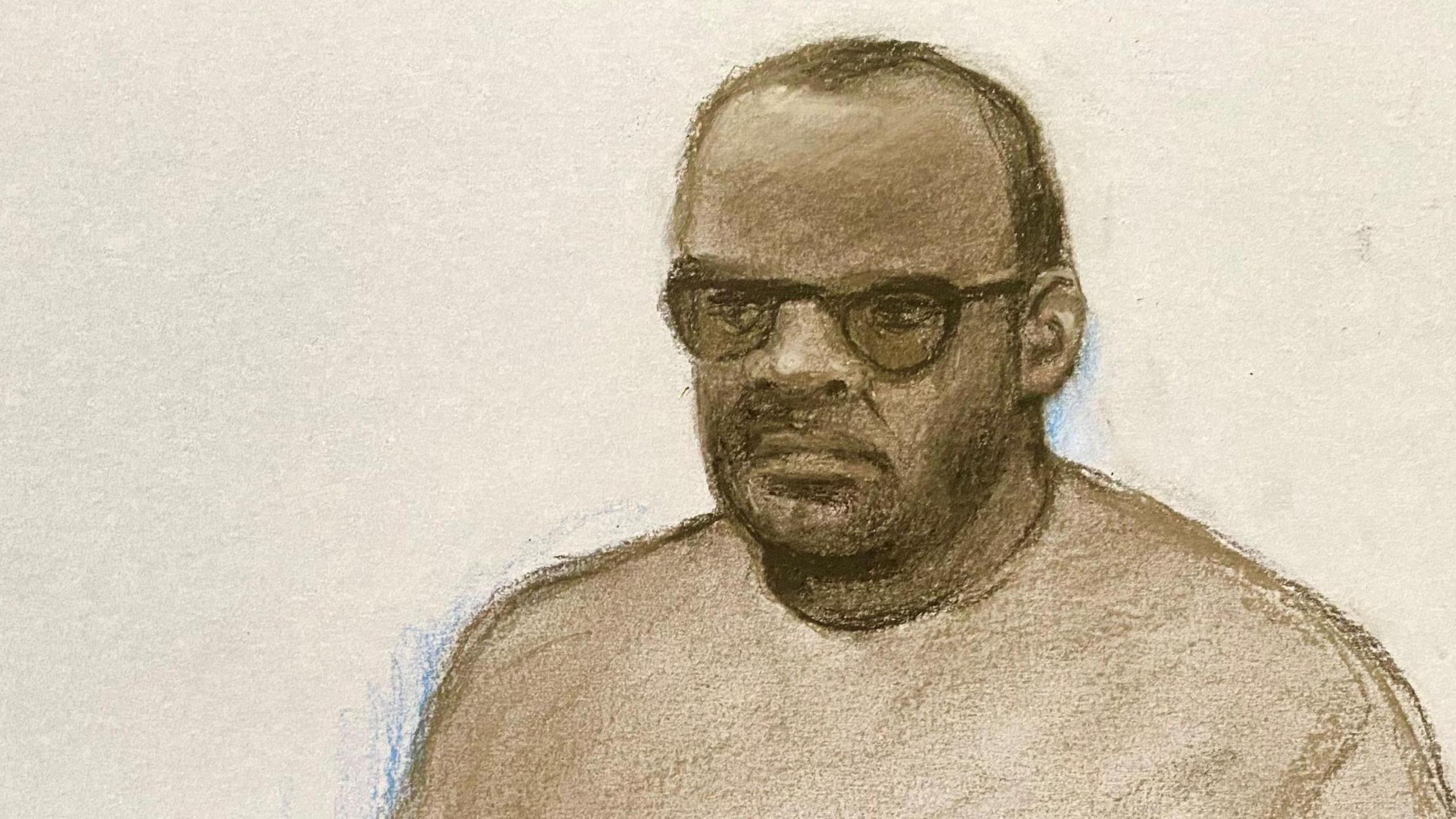 Court sketch of Simon Levy, wearing a beige tracksuit and glasses.