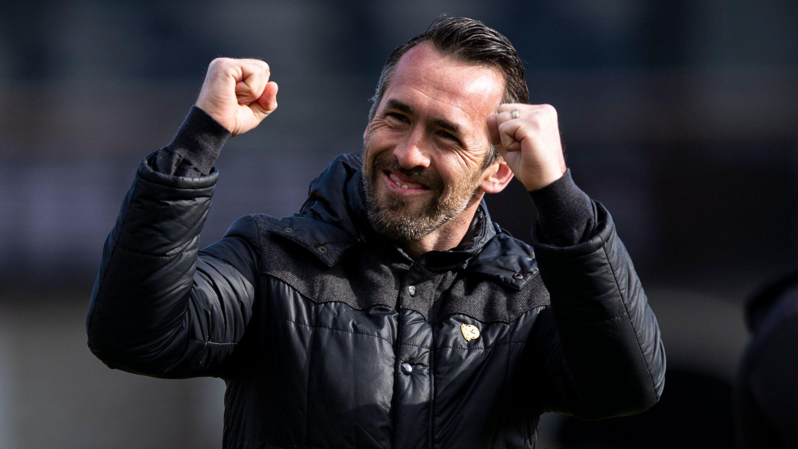 Christian Fuchs celebrates victory for his side over Harrogate Town.