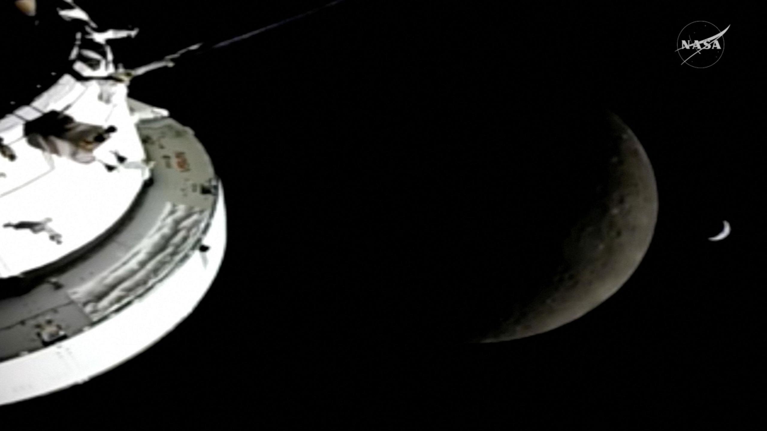 A view of the Moon and the Earth as the Artemis II mission's Orion spacecraft approaches to reach its furthest distance from Earth.