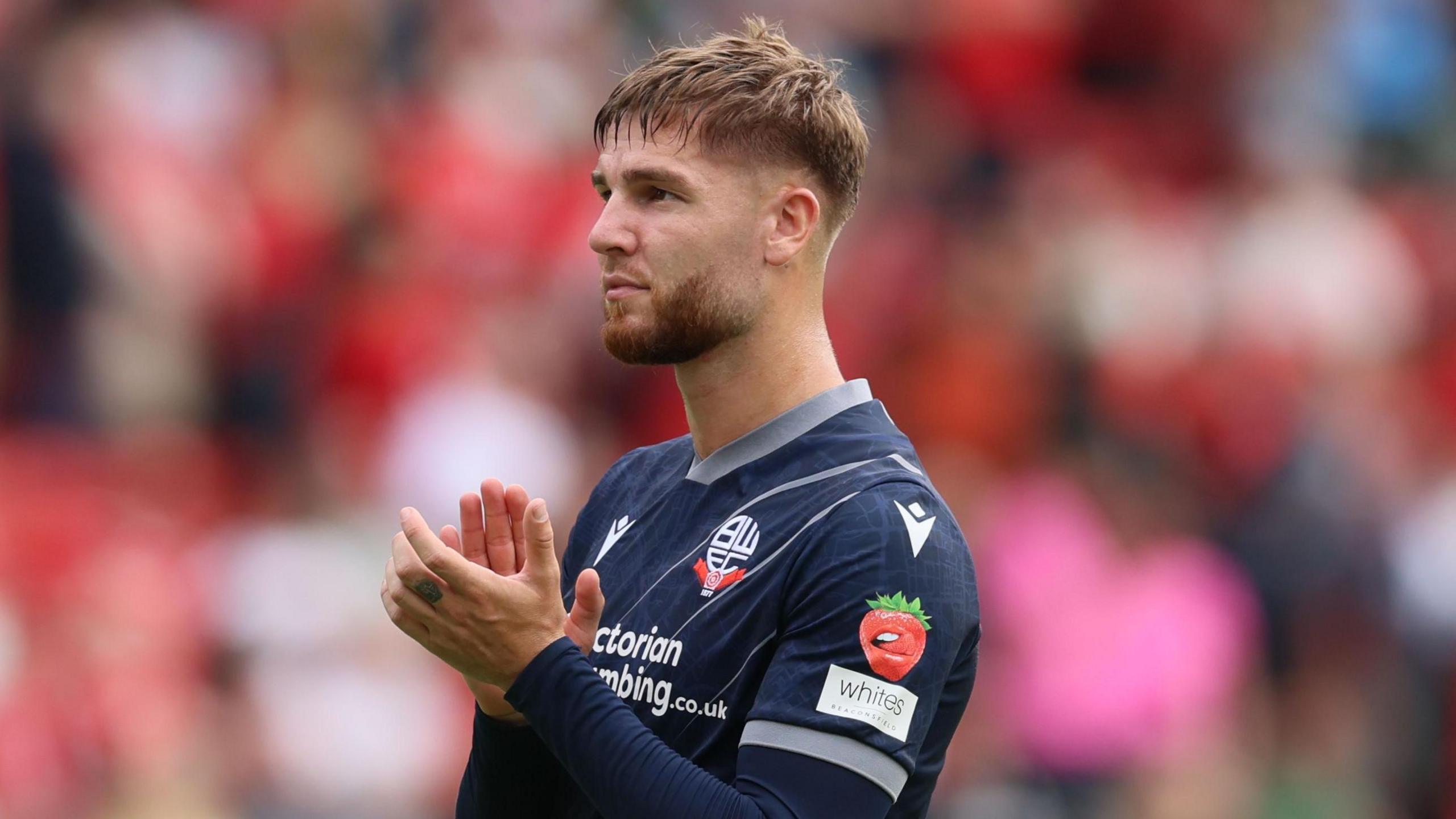 John McAtee applauds Bolton's supporters