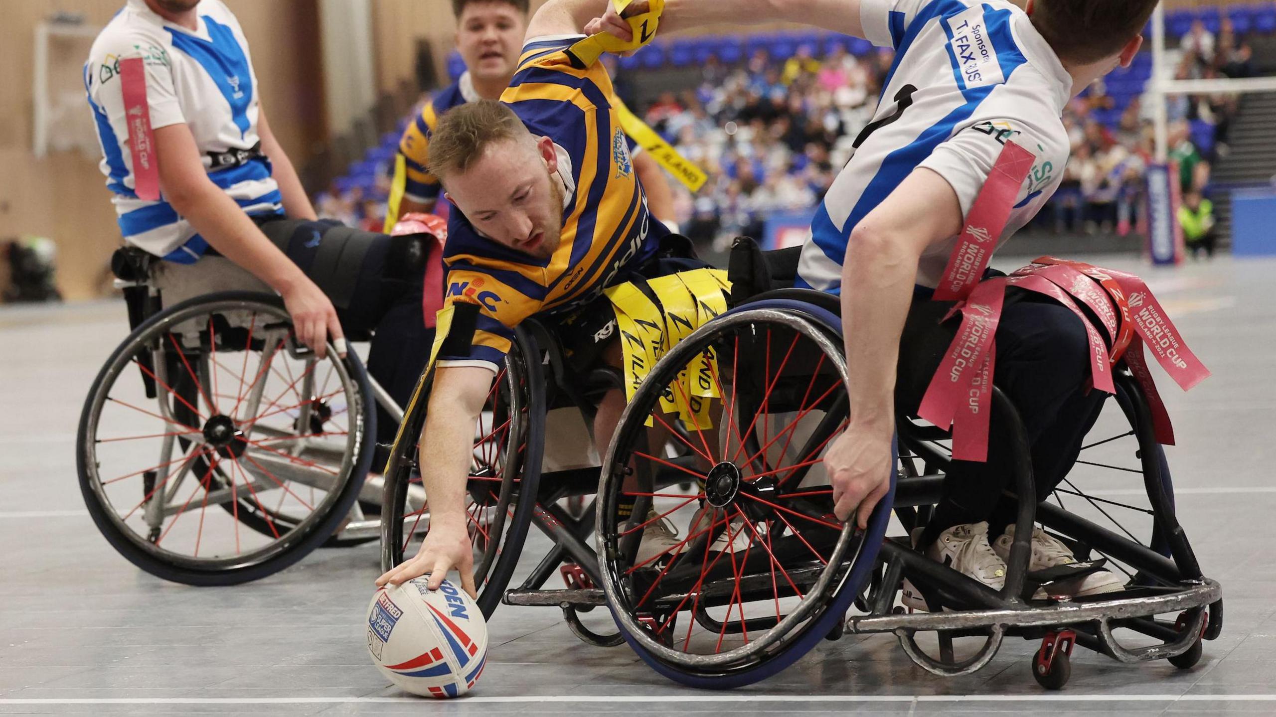 Nathan Collins reaches out with the ball for Leeds