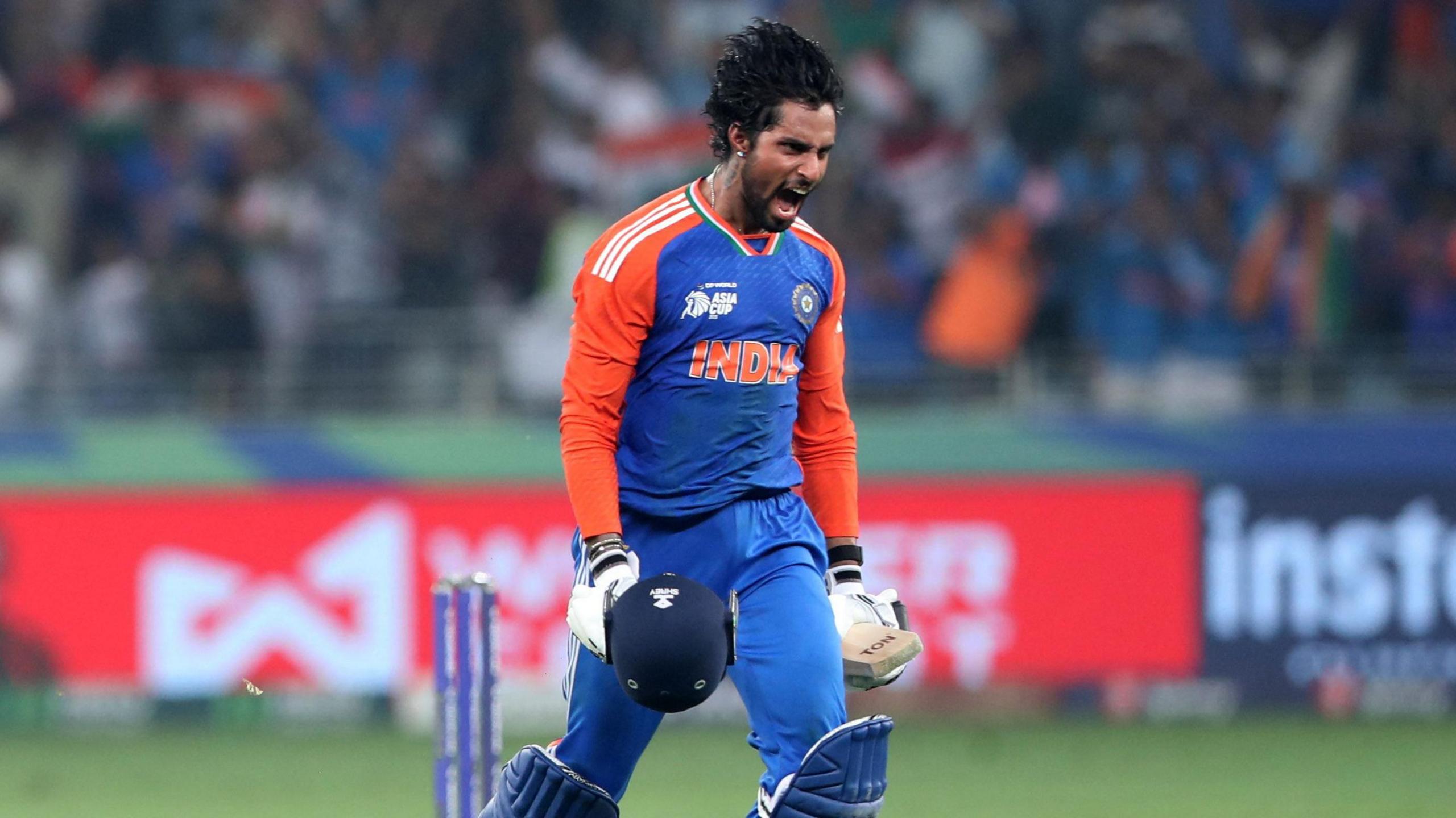 India's Tilak Varma celebrates after winning the Asia Cup