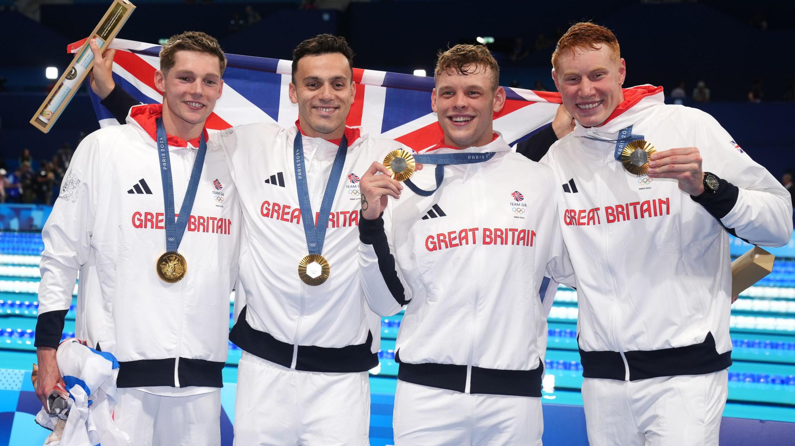 Great Britain's Duncan Scott, James Guy, Matthew Richards and Tom Dean pose with their gold medals