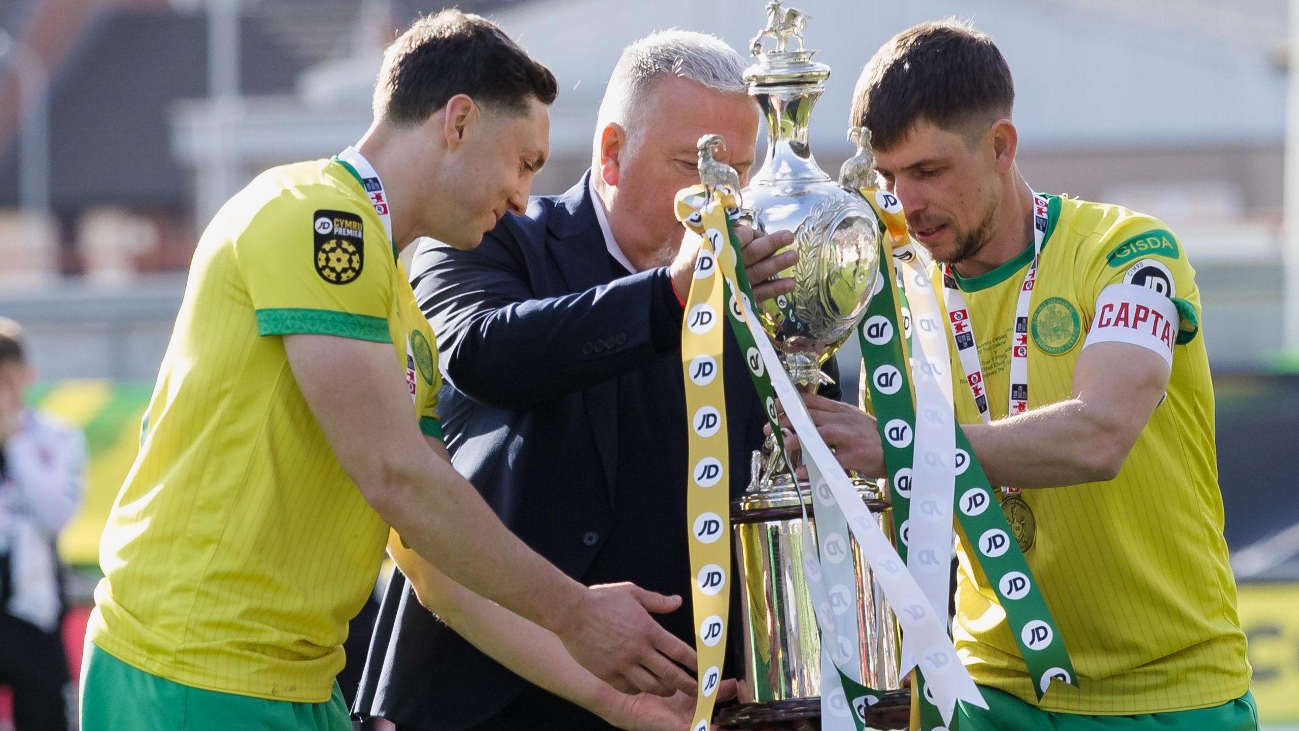Caernarfon's Danny Gosset and Darren Thomas with the Welsh Cup