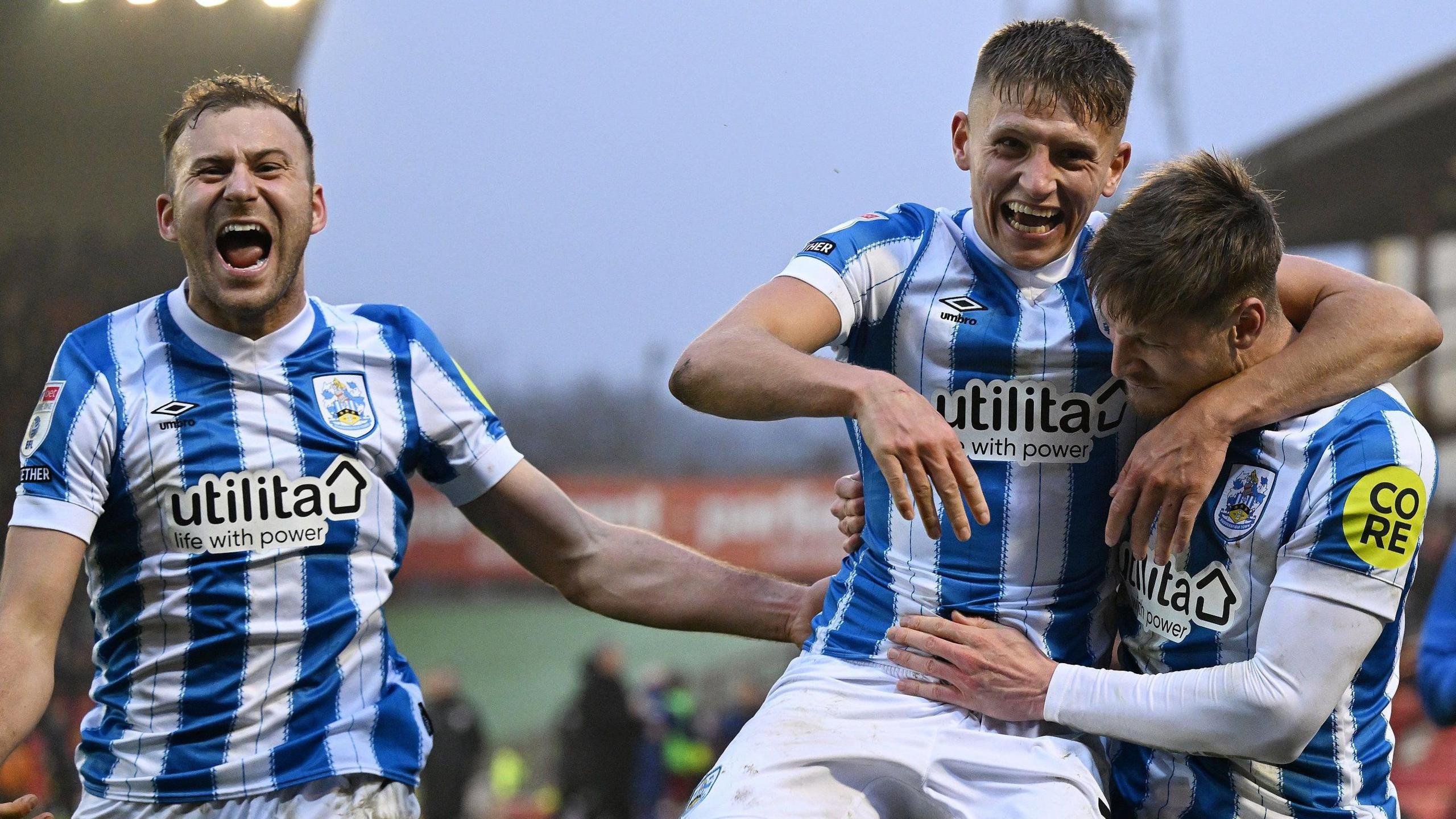 Huddersfield Town celebrate their winning goal at Barnsley