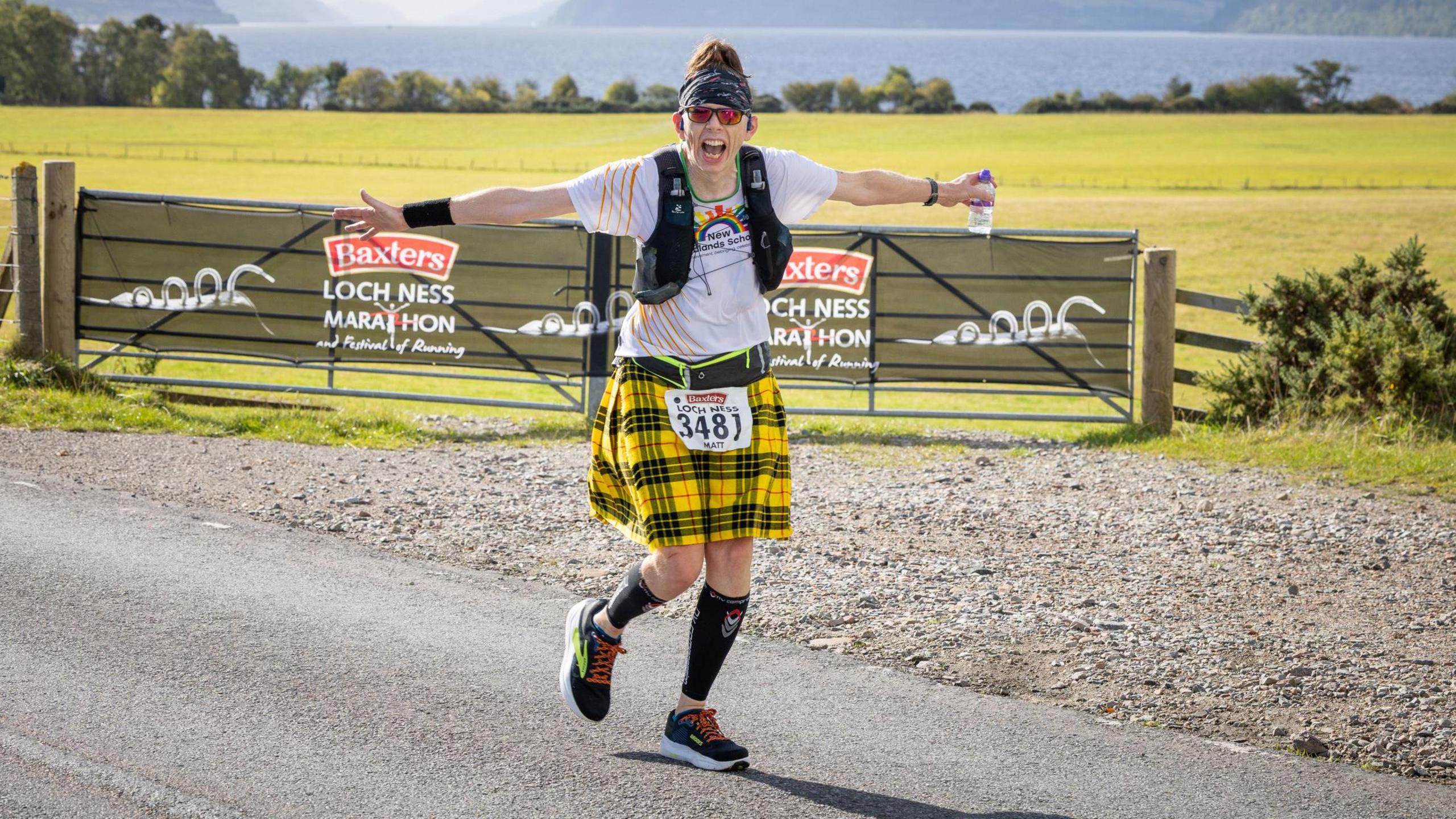 a female runner in a yellow kilt