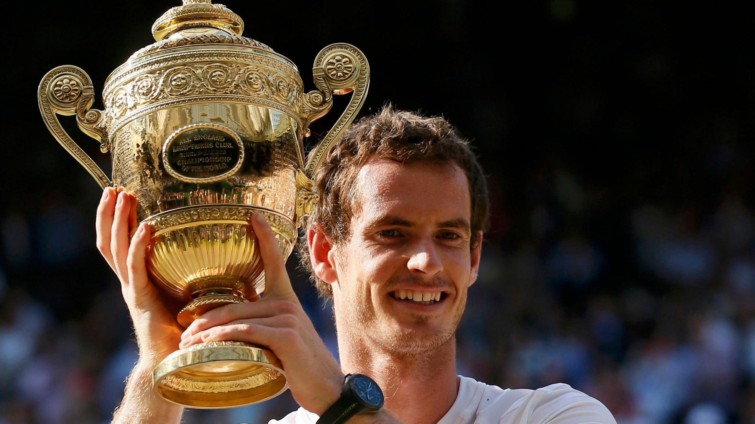 Sir Andy Murray lifts the Wimbledon trophy in 2013