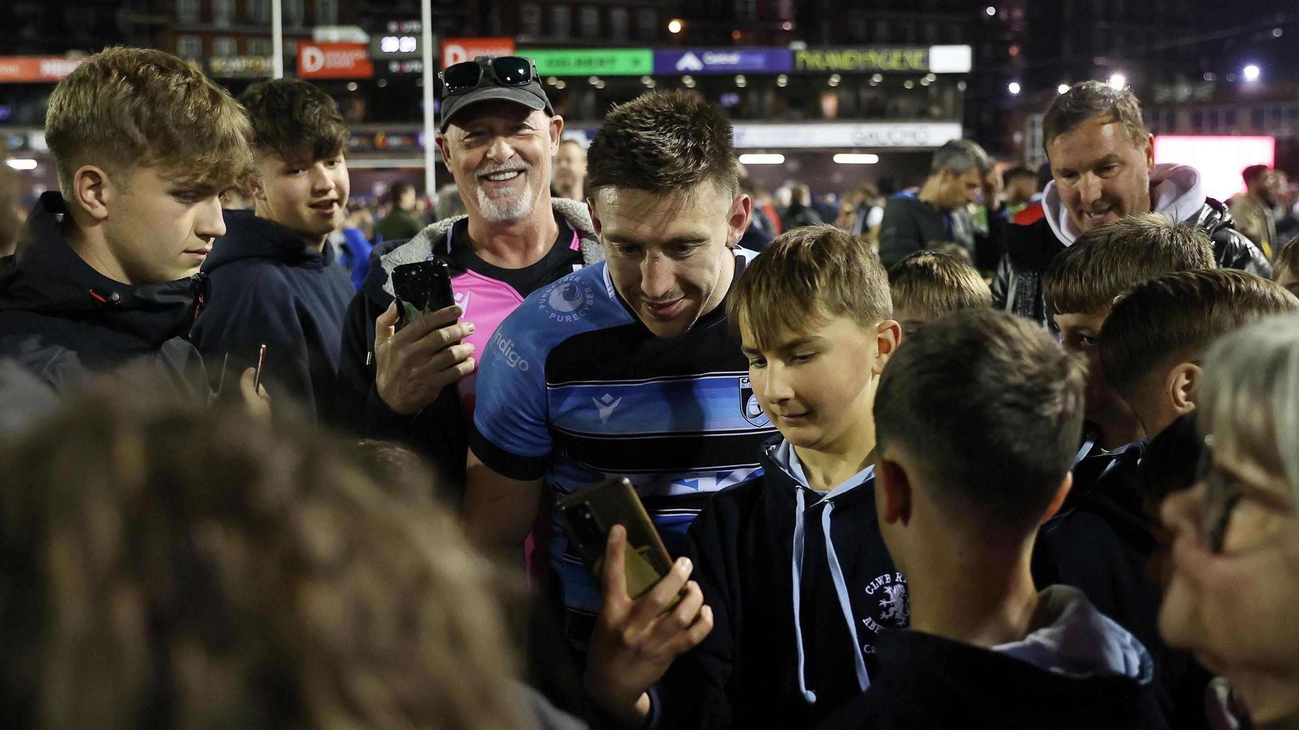 Cardiff wing Josh Adams poses with fans