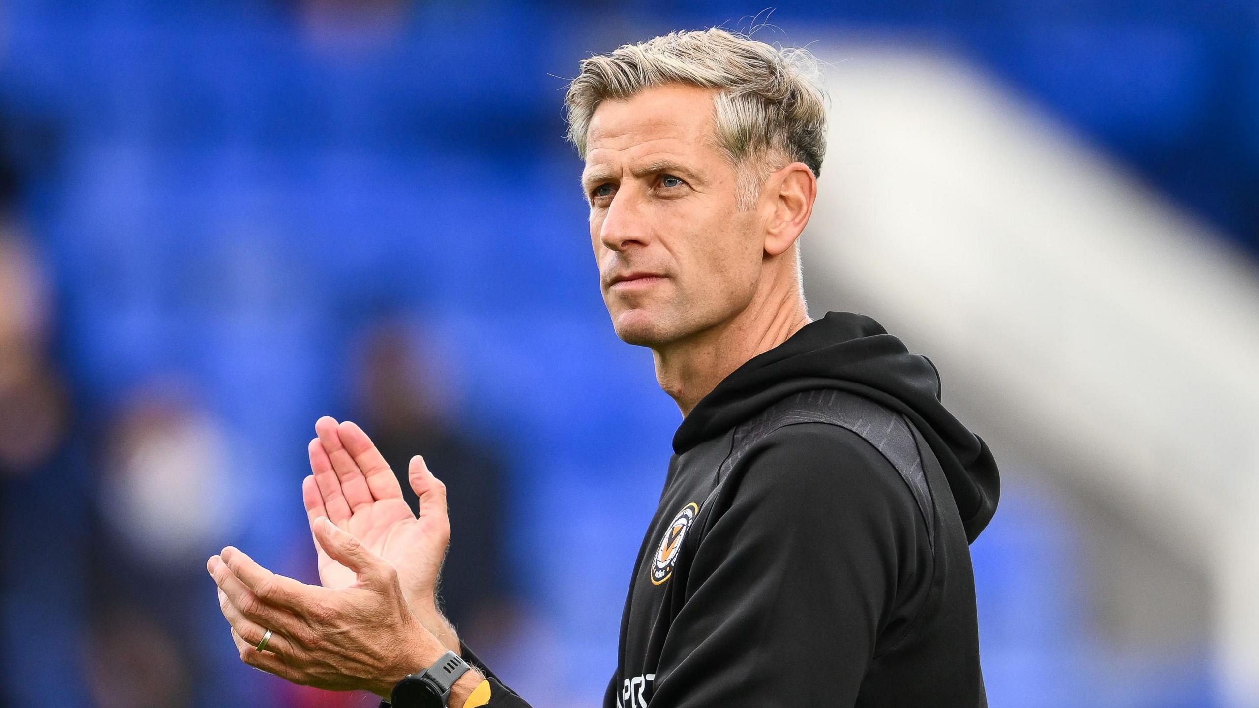 Newport boss Dave Hughes applauds the fans 