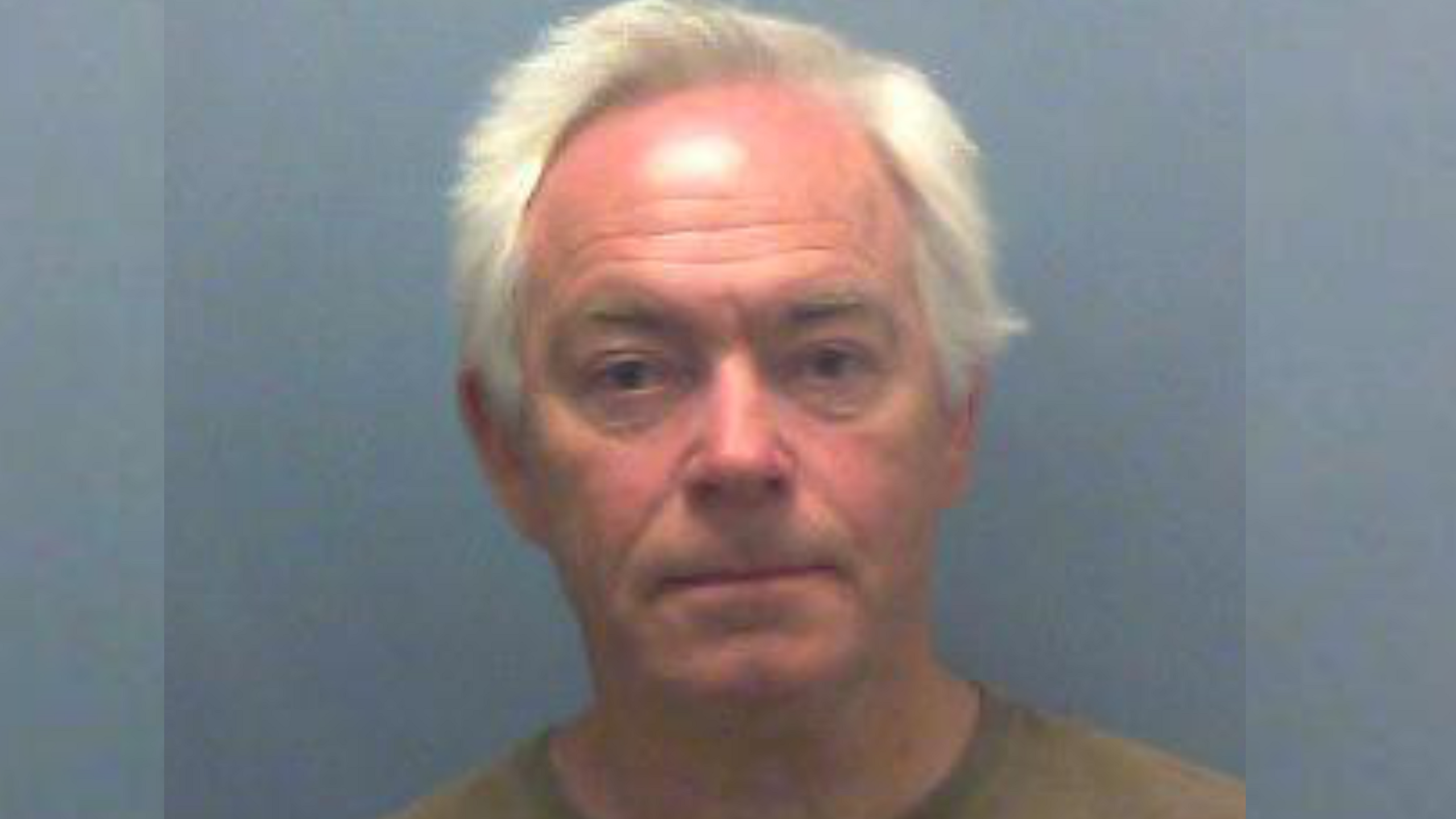 A mugshot of Angus Blackmore - an elderly man with white hair.