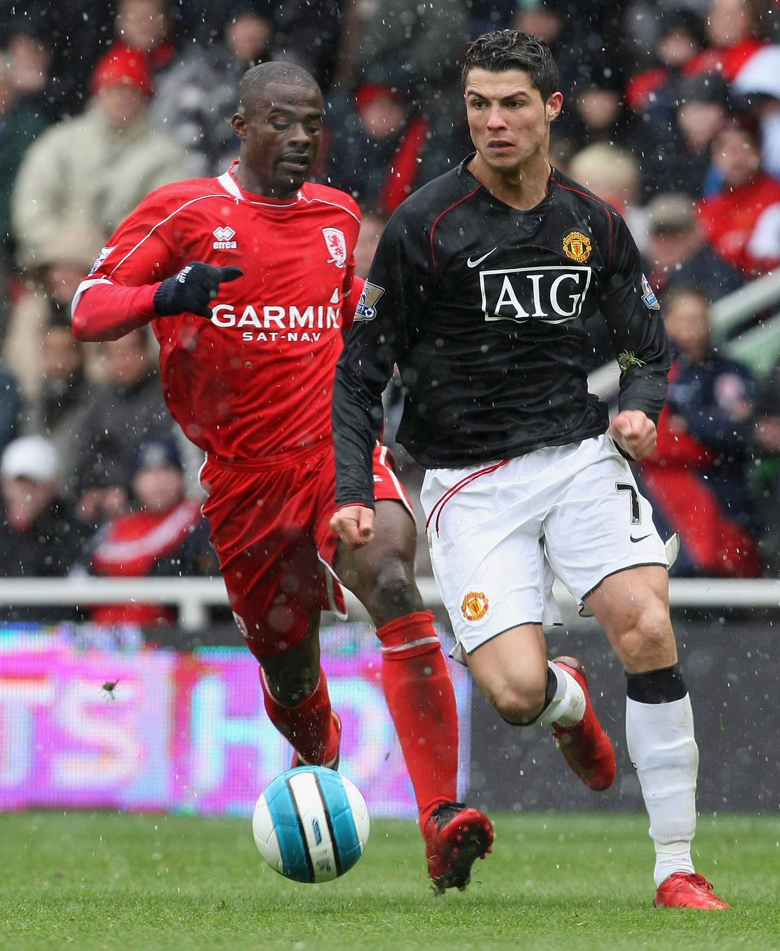 Cristiano Ronaldo of Manchester United clashes with George Boateng of Middlesbrough during the Barclays FA Premier League match between Middlesbrough and Manchester United at the Riverside Stadium on 6 April 2008