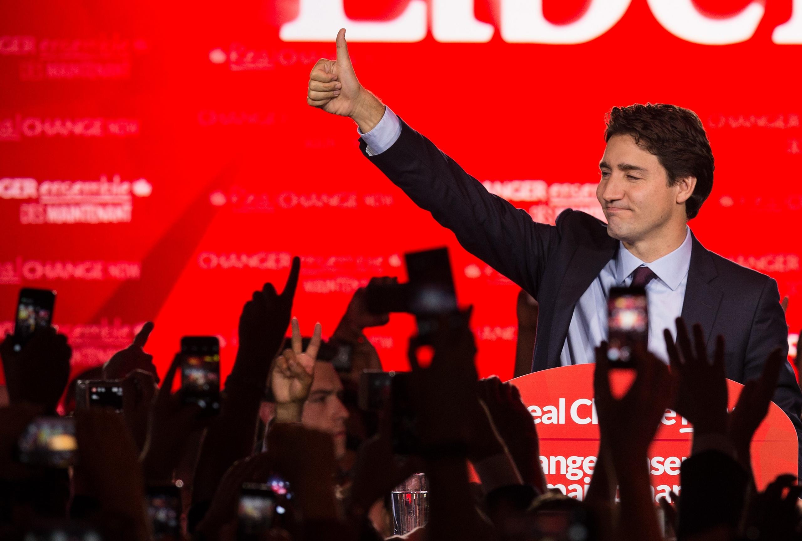 Canadian Liberal Party leader Justin Trudeau waves on stage in Montreal on October 20, 2015 after winning the general elections.