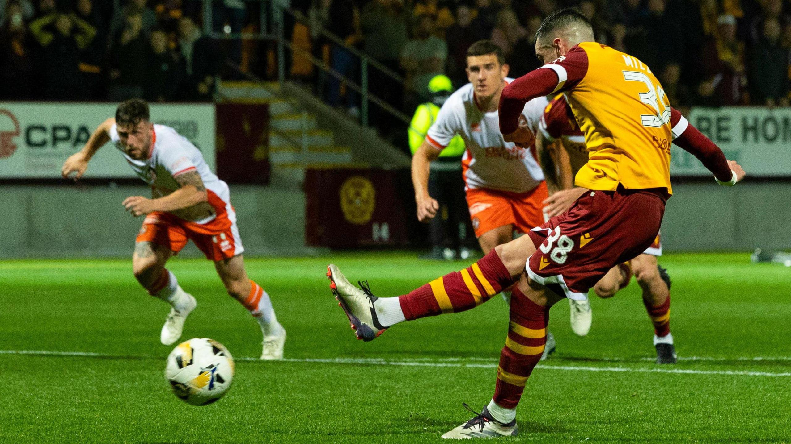 Motherwell's Lennon Miller scores