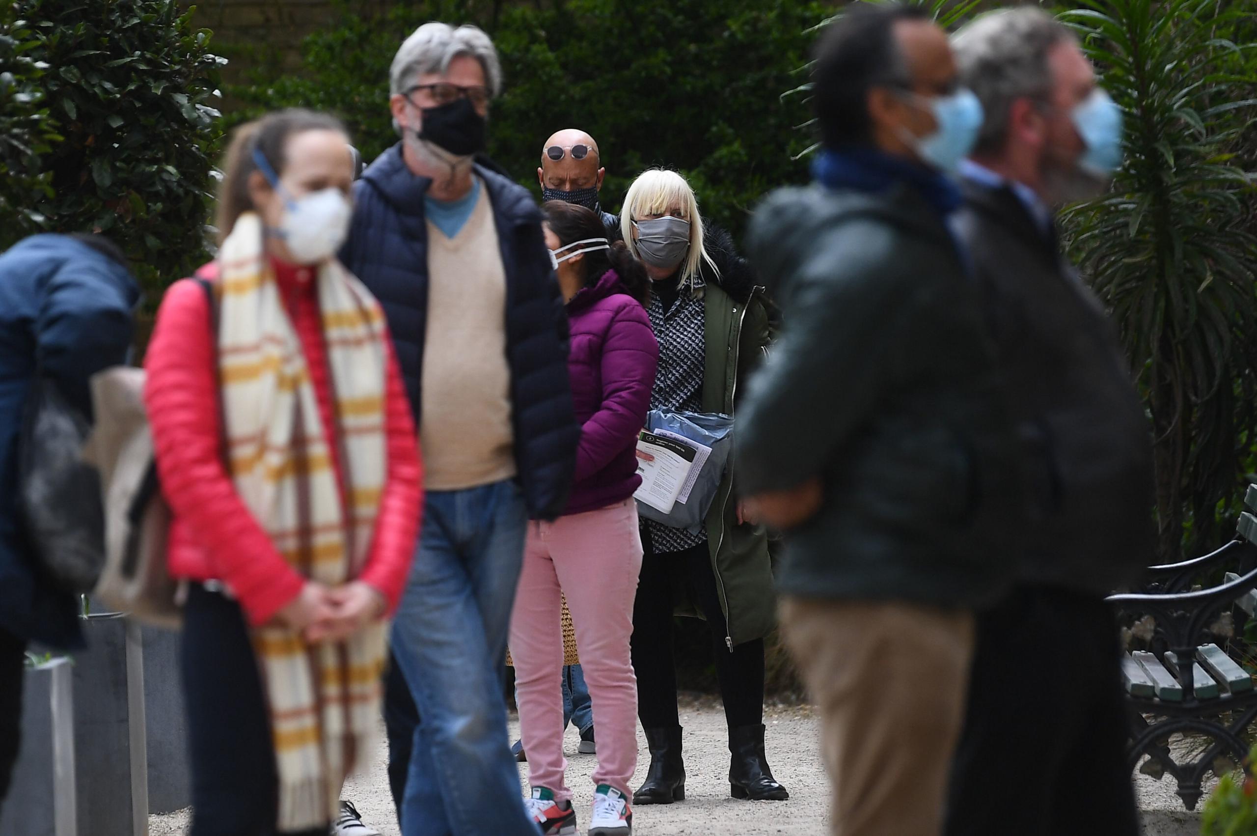 People take Covid-19 tests at a mobile coronavirus surge testing centre in Brockwell Park in south London, on April 13, 2021