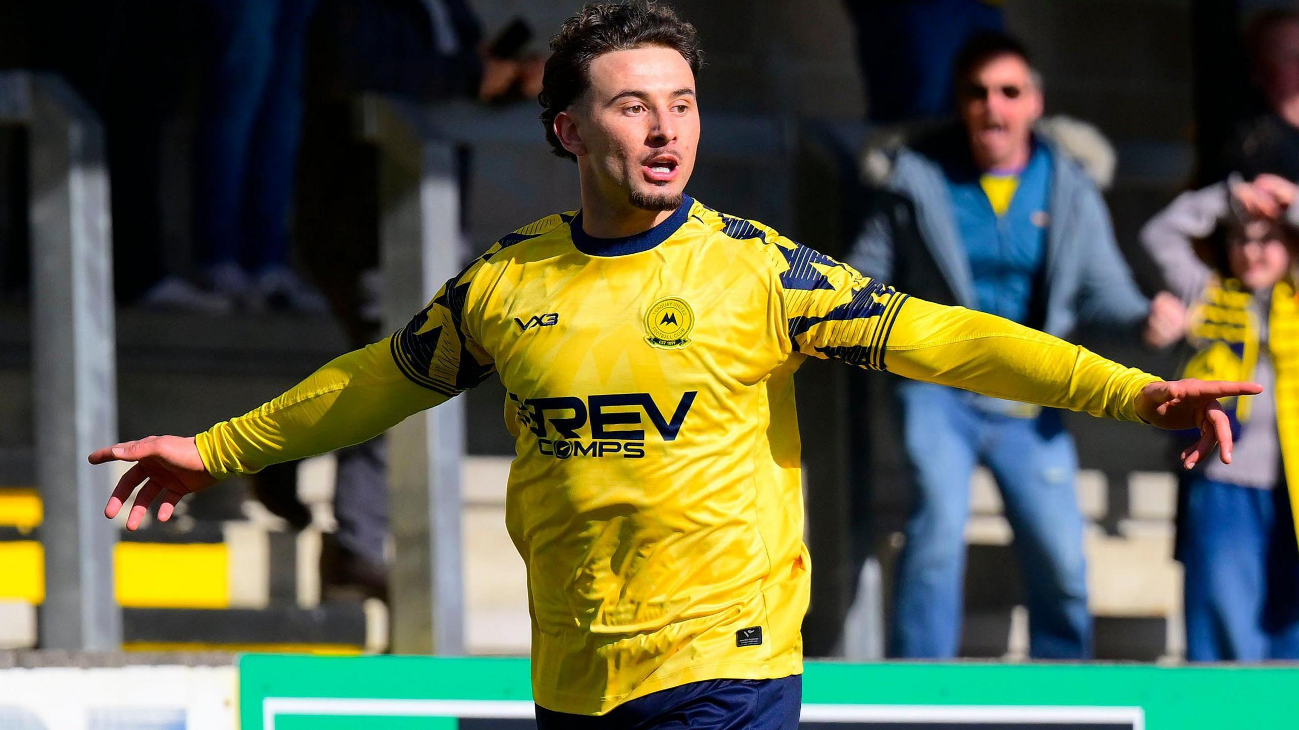 Dylan Morgan celebrates scoring for Torquay