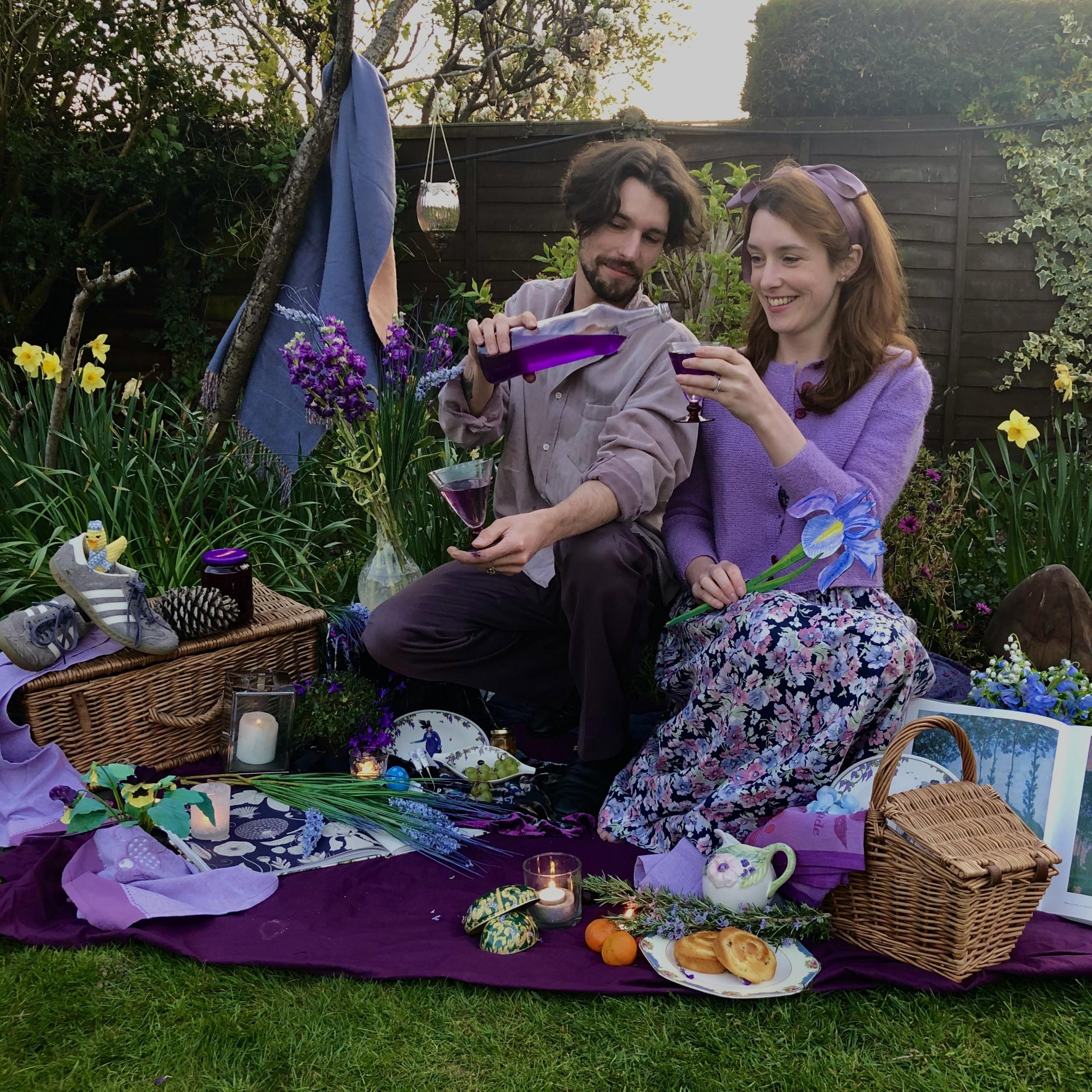 Helen Yang and Thomas Etheridge in purple outfits