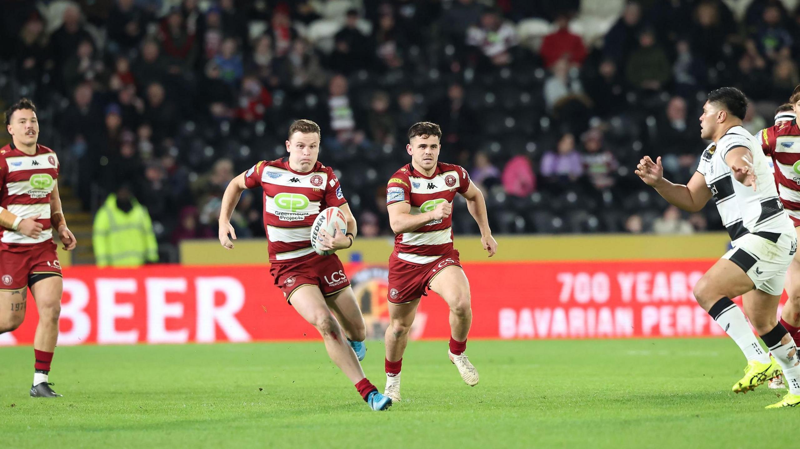 Wigan full back Jai Field drives forward against Hull