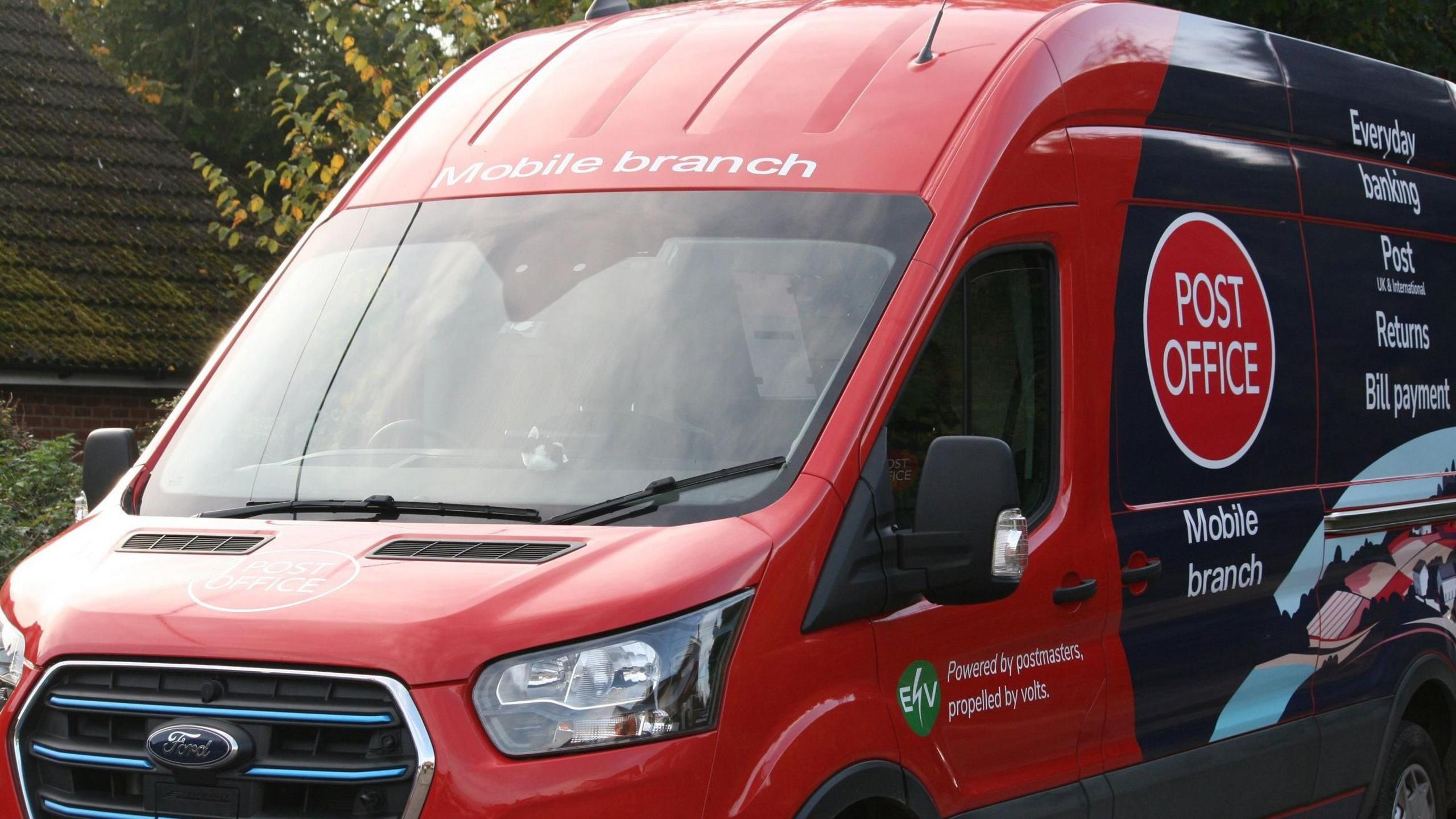 a red post office van