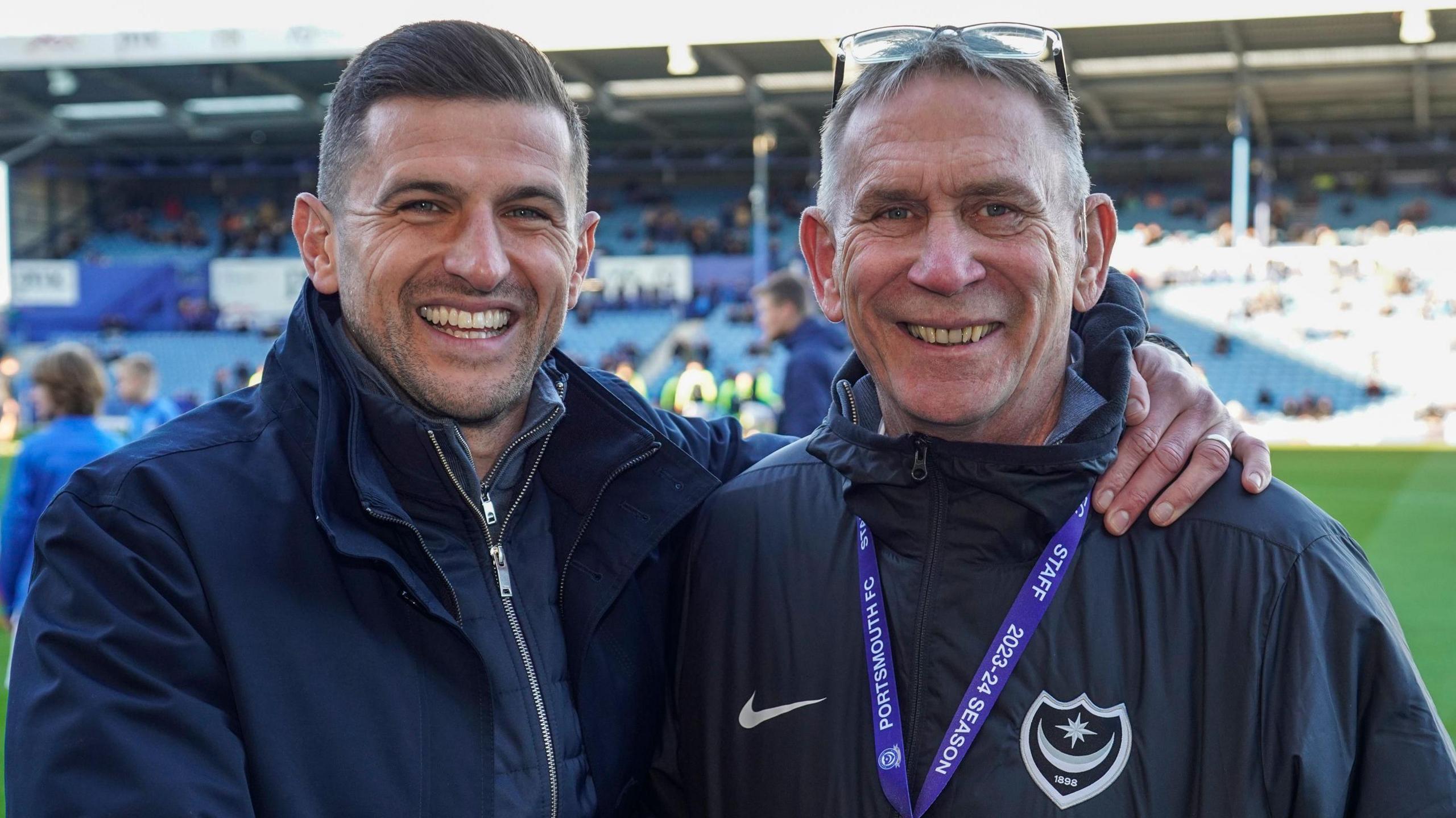 Alan Knight smiling with Portsmouth boss John Mousinho