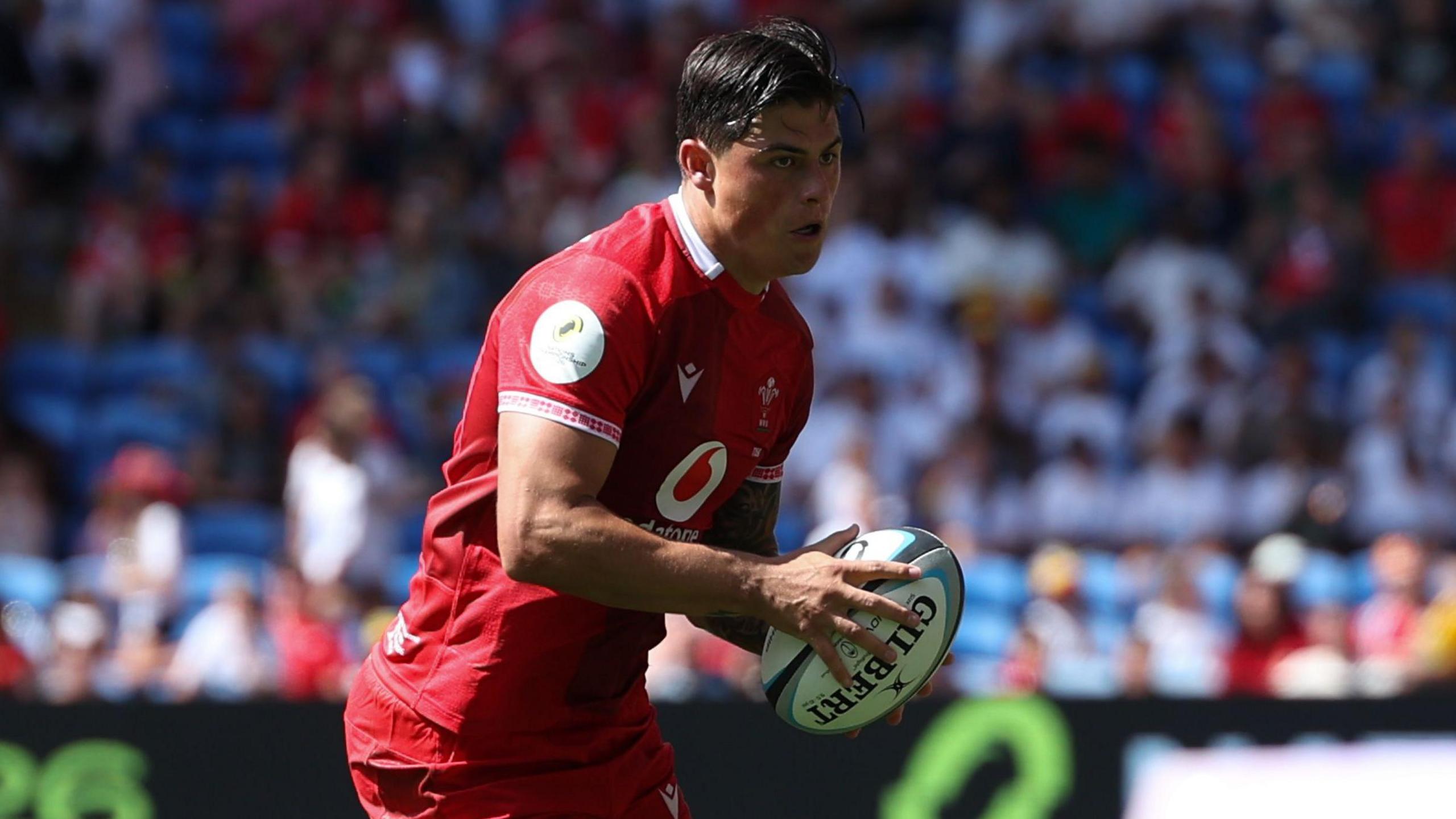 Louis Rees-Zammit in possession against Fiji