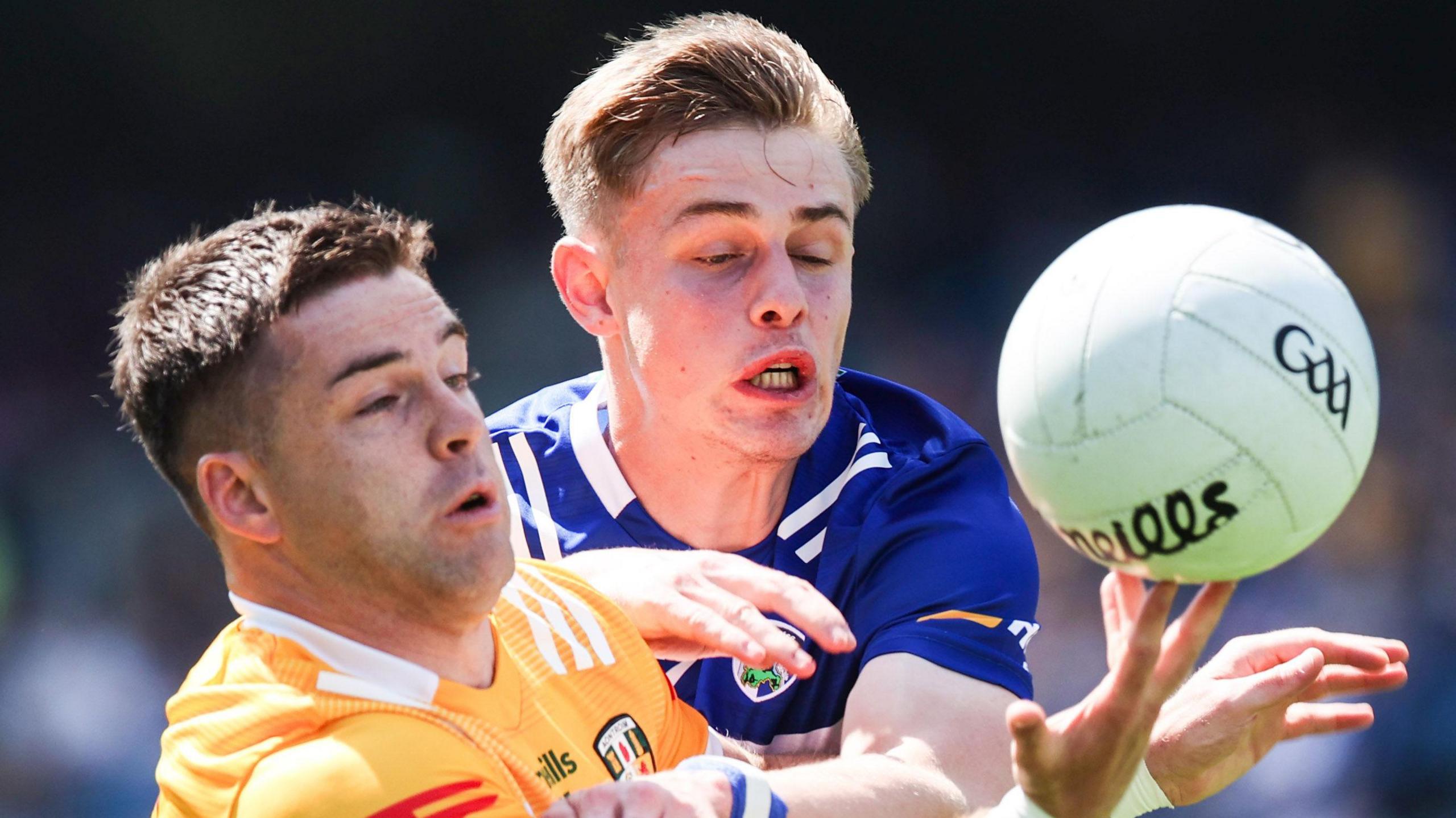 Paddy McBride and Laois' Simon Fingleton tussle for possession