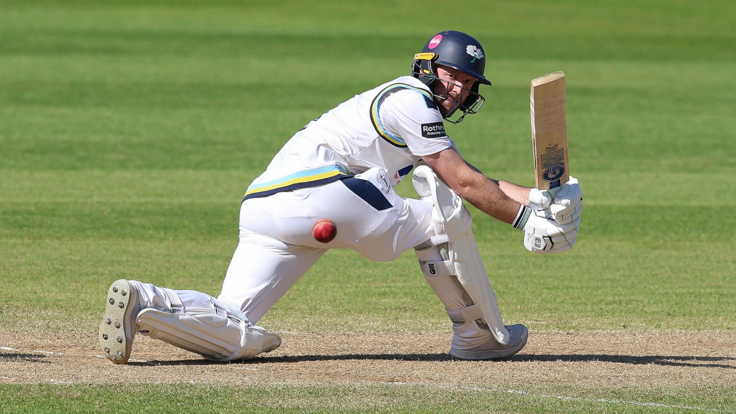 Adam Lyth sweeps a shot for Yorkshire against Glamorgan