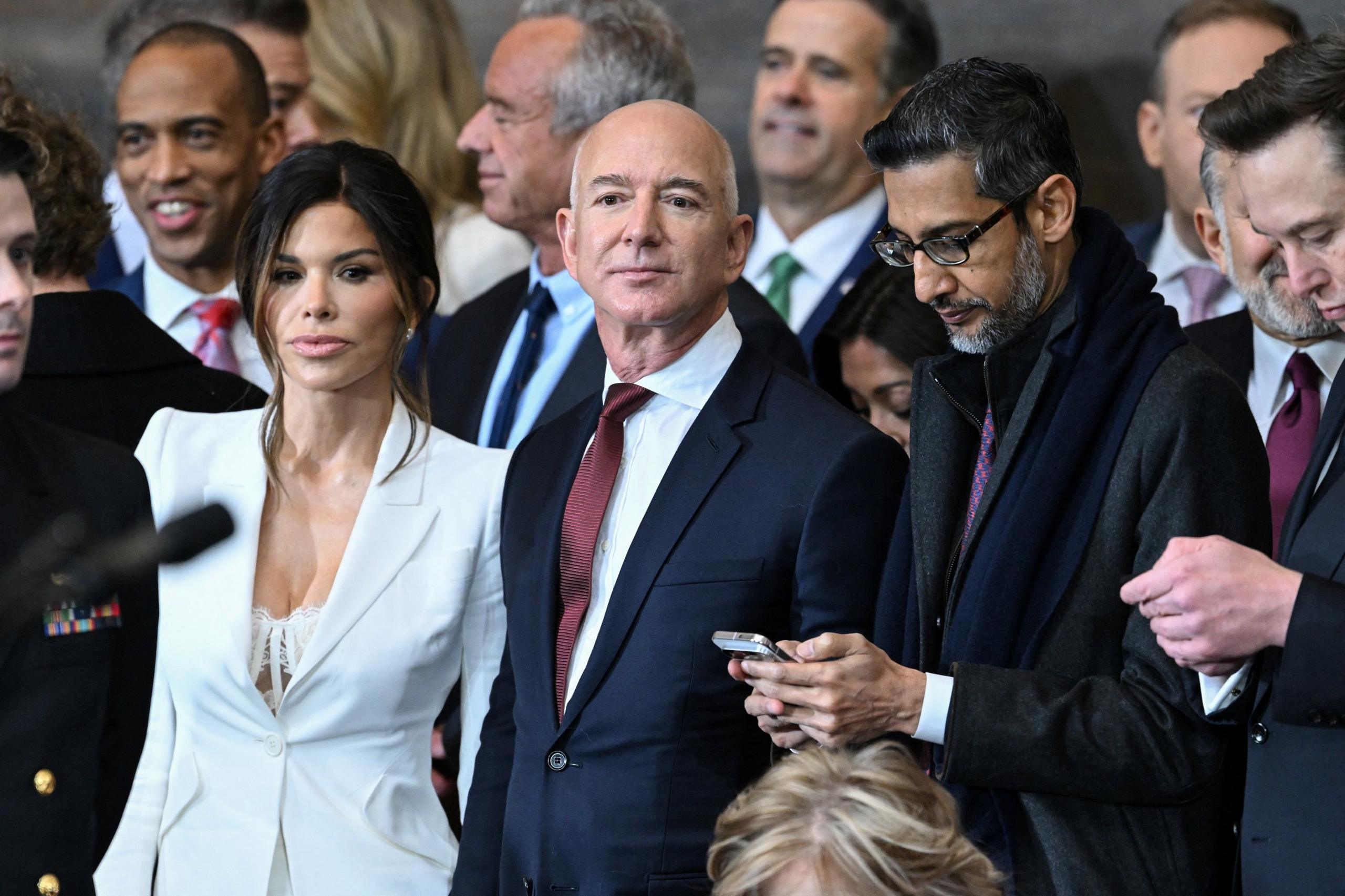 Lauren Sanchez, Jeff Bezos, Sundar Pichai and Elon Musk in a crowd of inauguration attendees