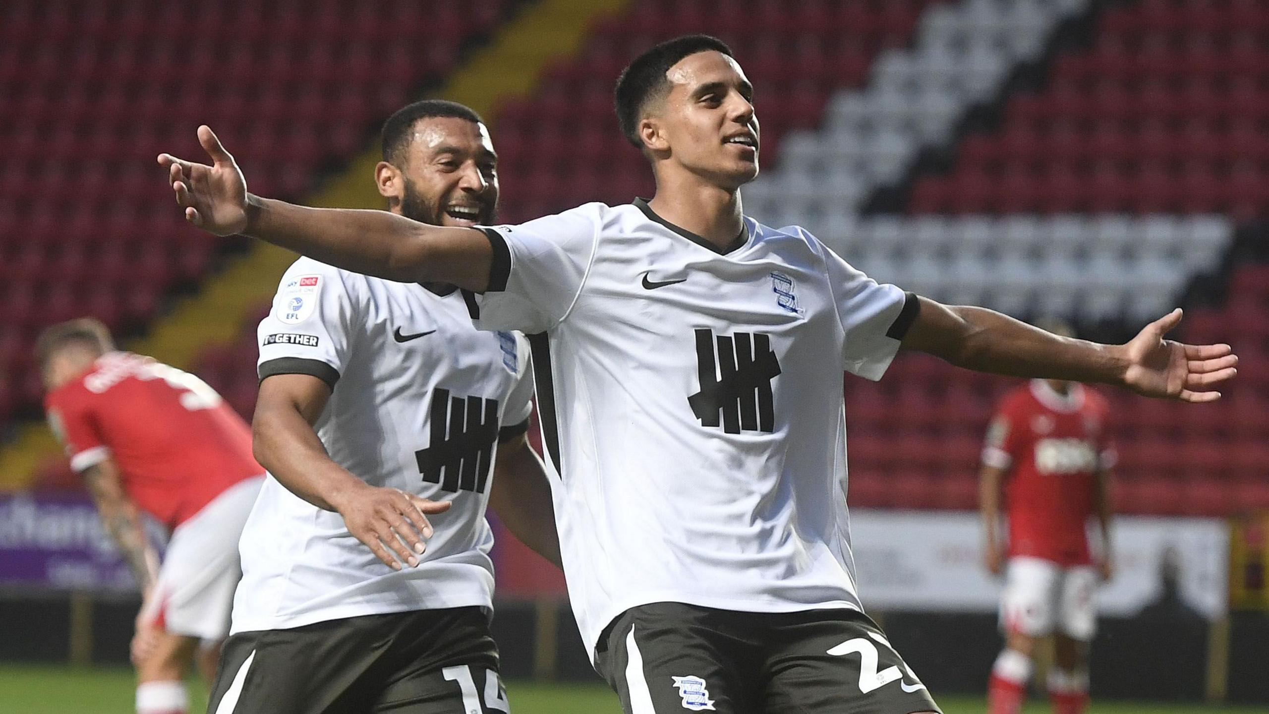 Brandon Khela puts his arms out wide in celebration after scoring for Birmingham City