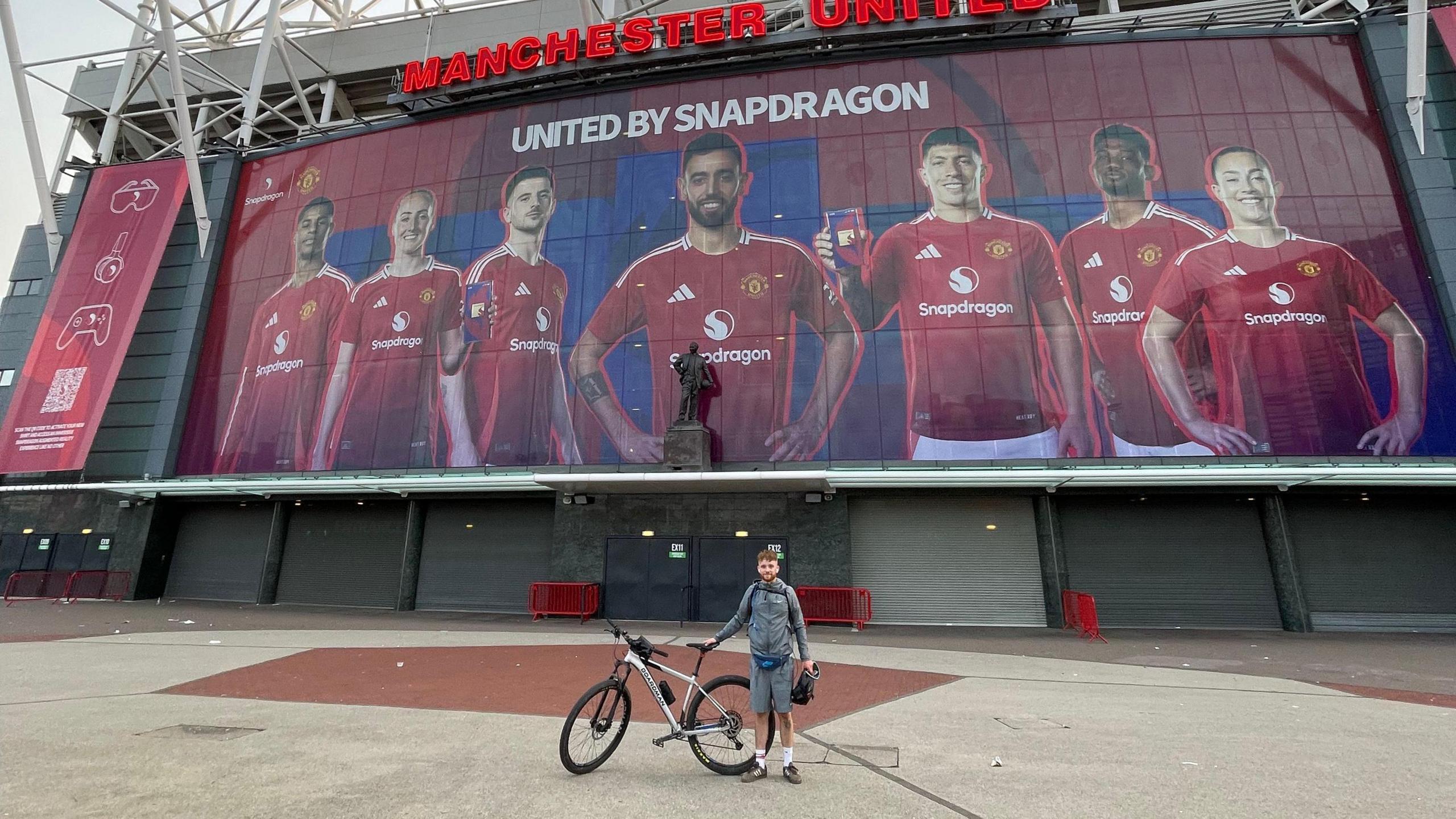 Ted Harrison outside Old Trafford with his bike