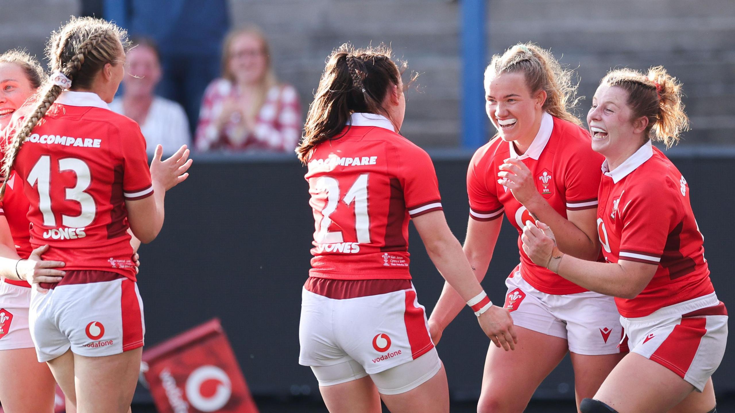 Wales players celebrate a try against Spain