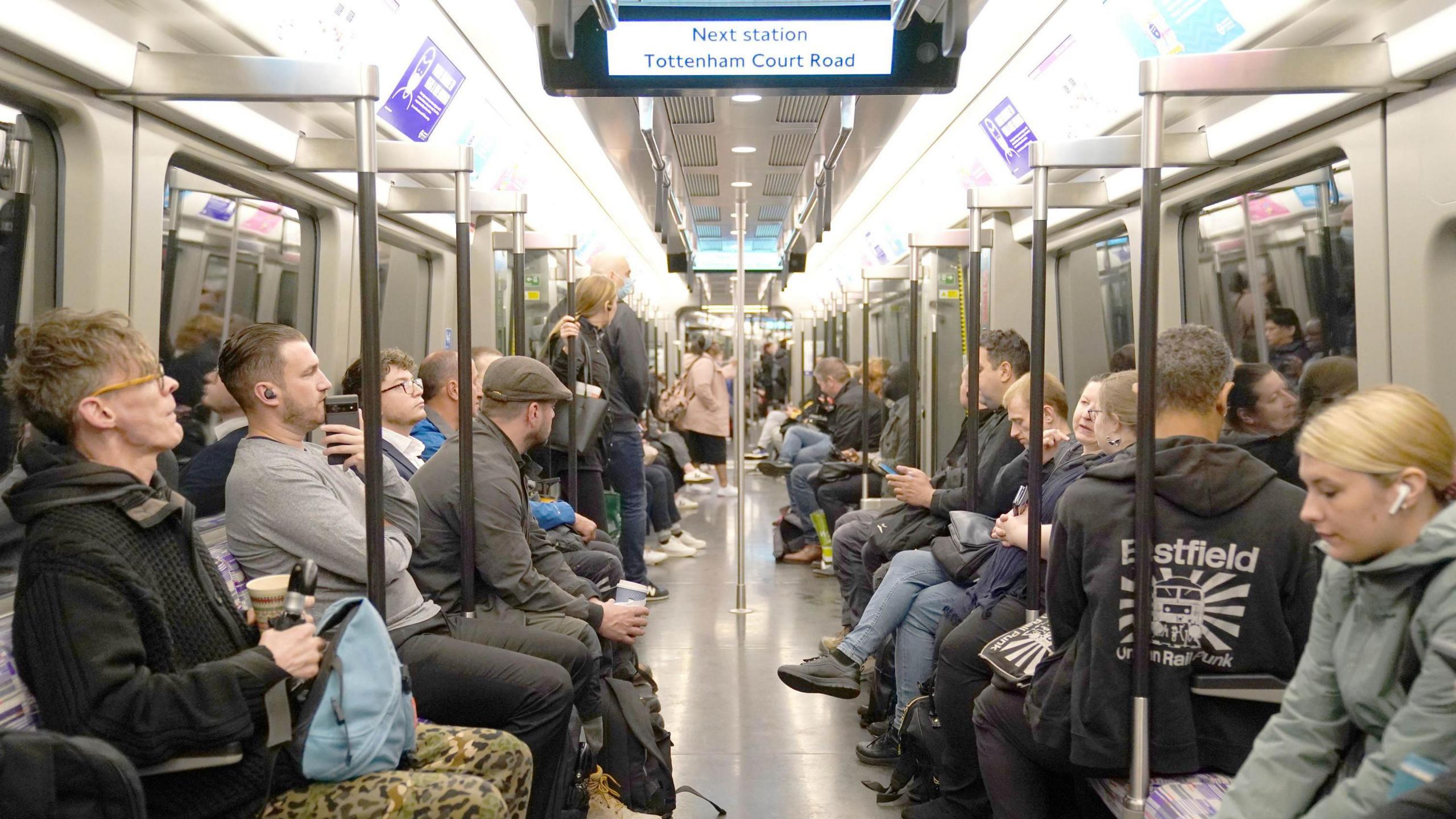 Passengers on an Elizabeth line train