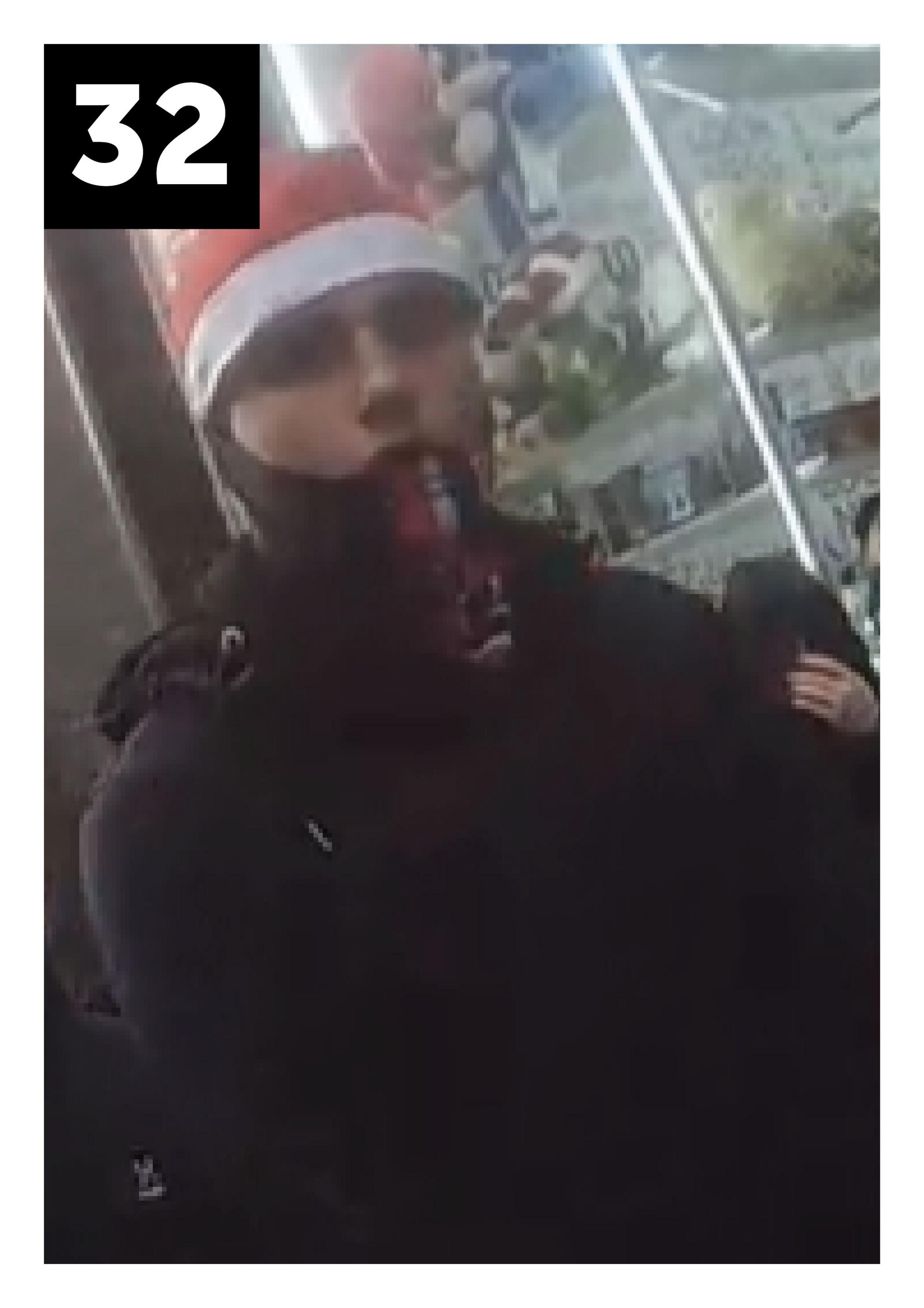 Man with dark jacket and santa hat