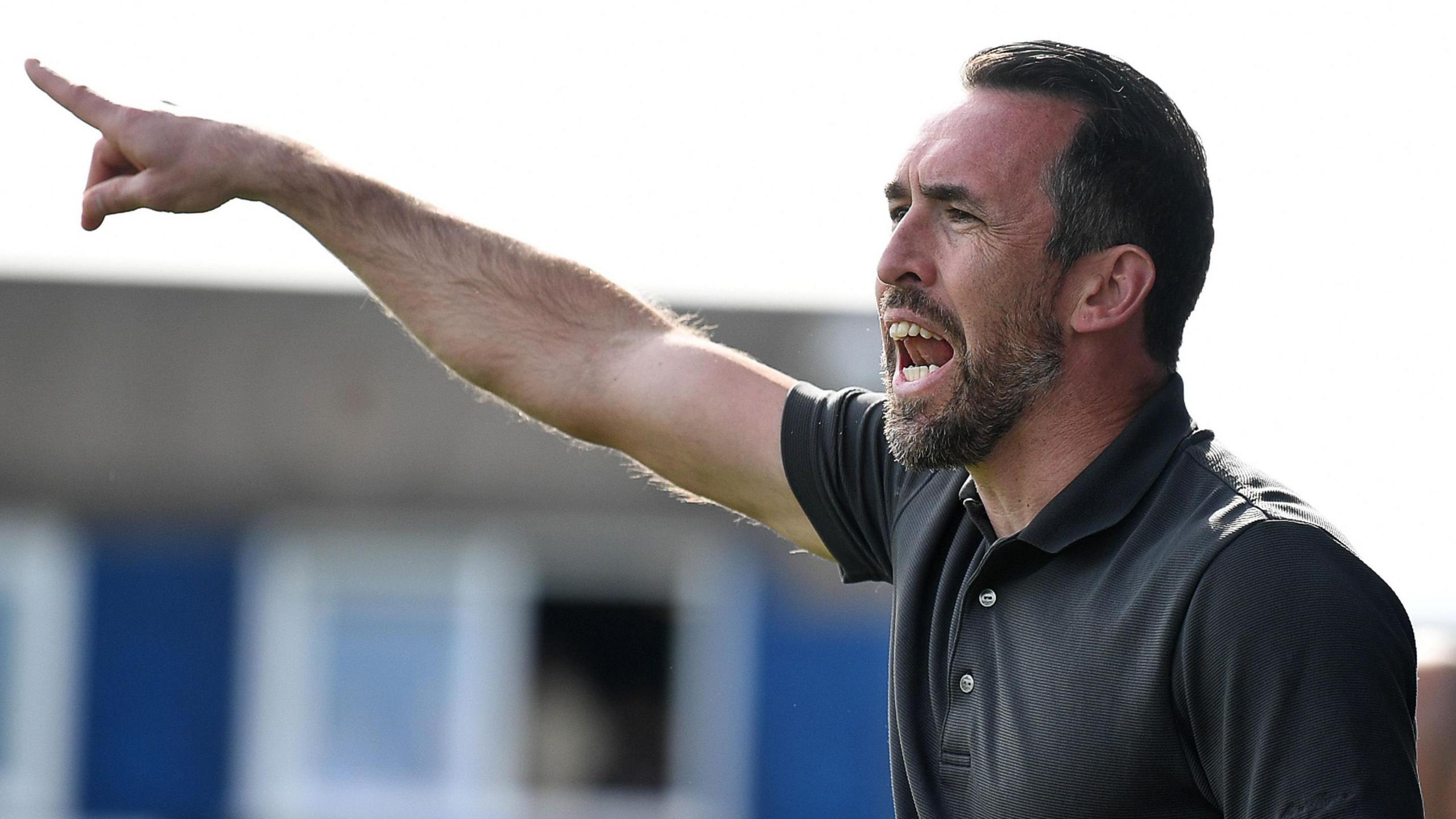 Christian Fuchs shouts instructions at Barrow on the final day of the season
