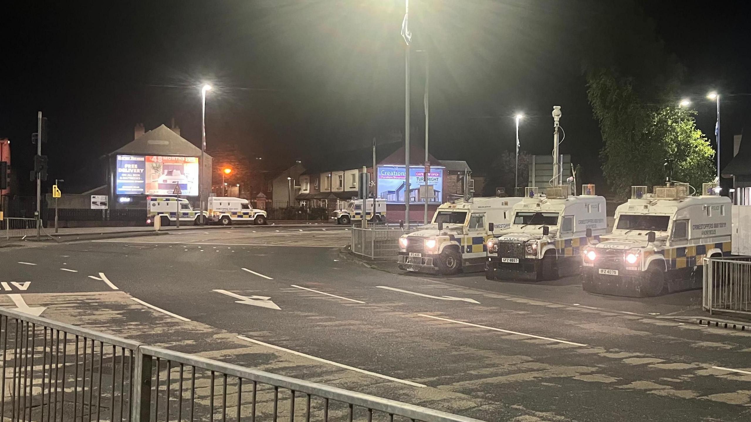 Police vehicles at Broadway roundabout in south Belfast on 15 July, 2024