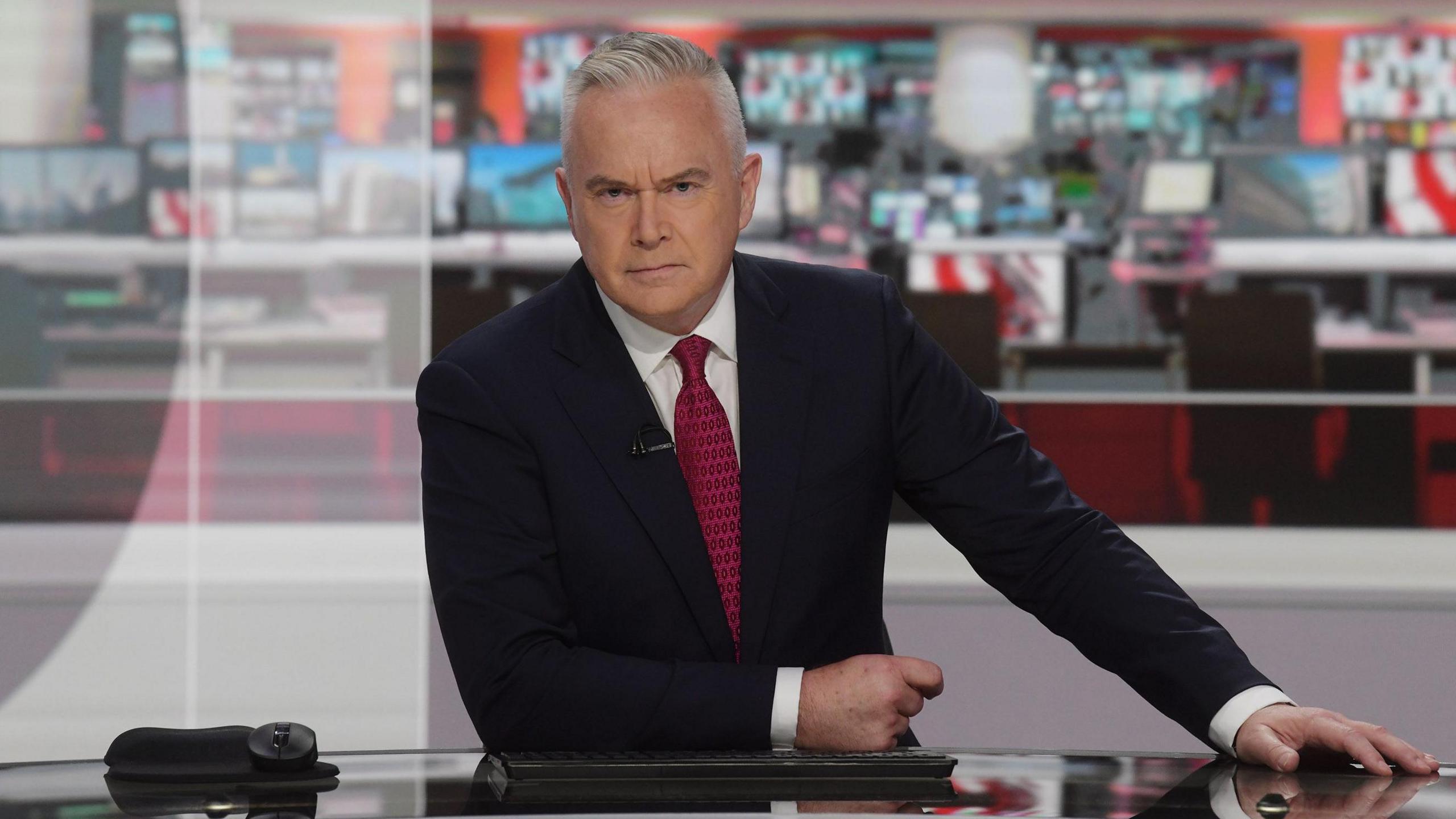 Huw Edwards presenting the news