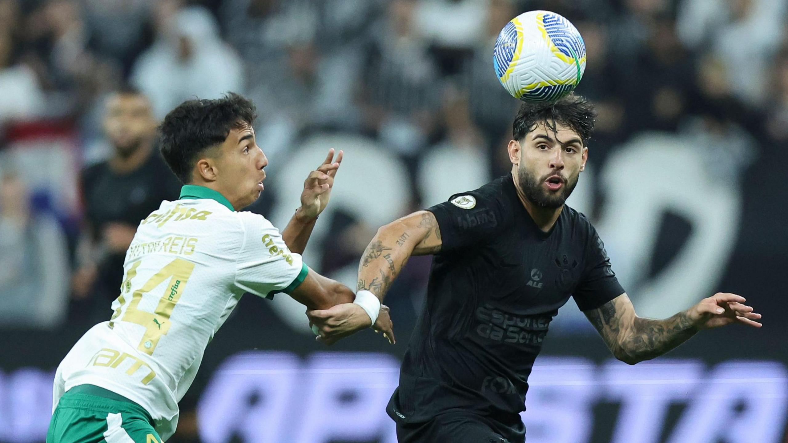 Corinthians forward Yuri Alberto (right) tussles with an opposition player