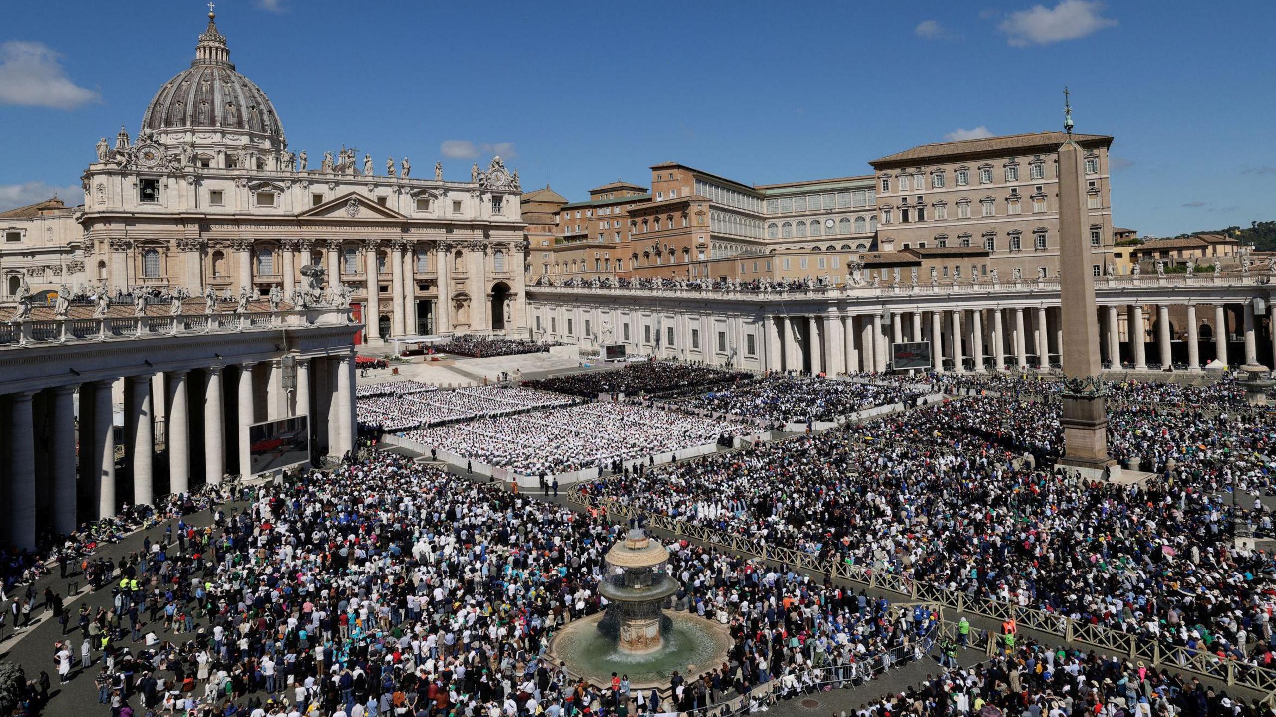 People attend the funeral Mass of Pope Francis in St. Peter's Square at the Vatican, April 26, 2025.