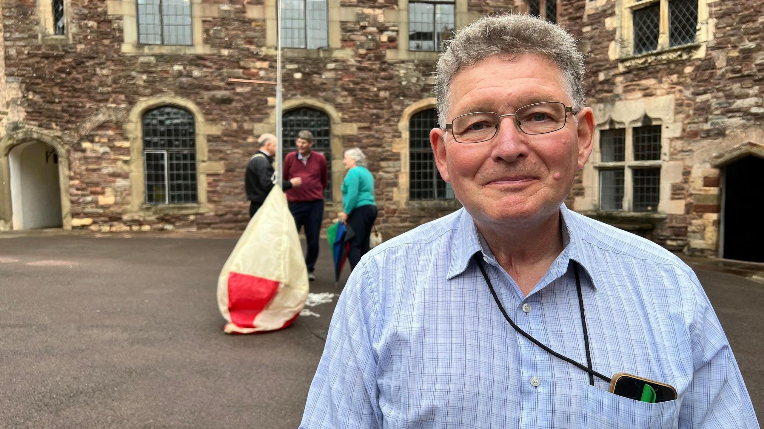 Nick Parker at Berkeley Castle, with the balloon behind him