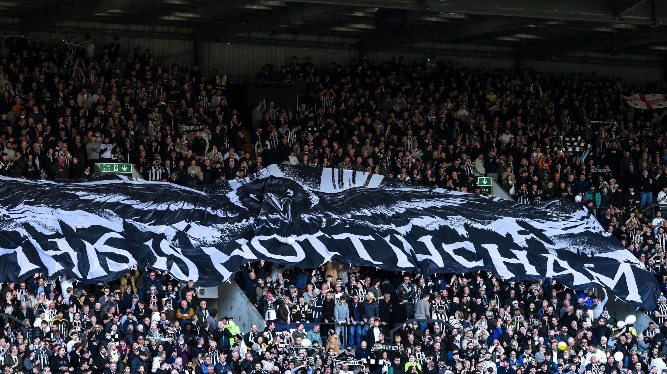 Giant banner that reads 'This is Nottingham' is unfurled by Notts County fans at Meadow Lane before their play-off semi-final tie against Chesterfield at Meadow Lane