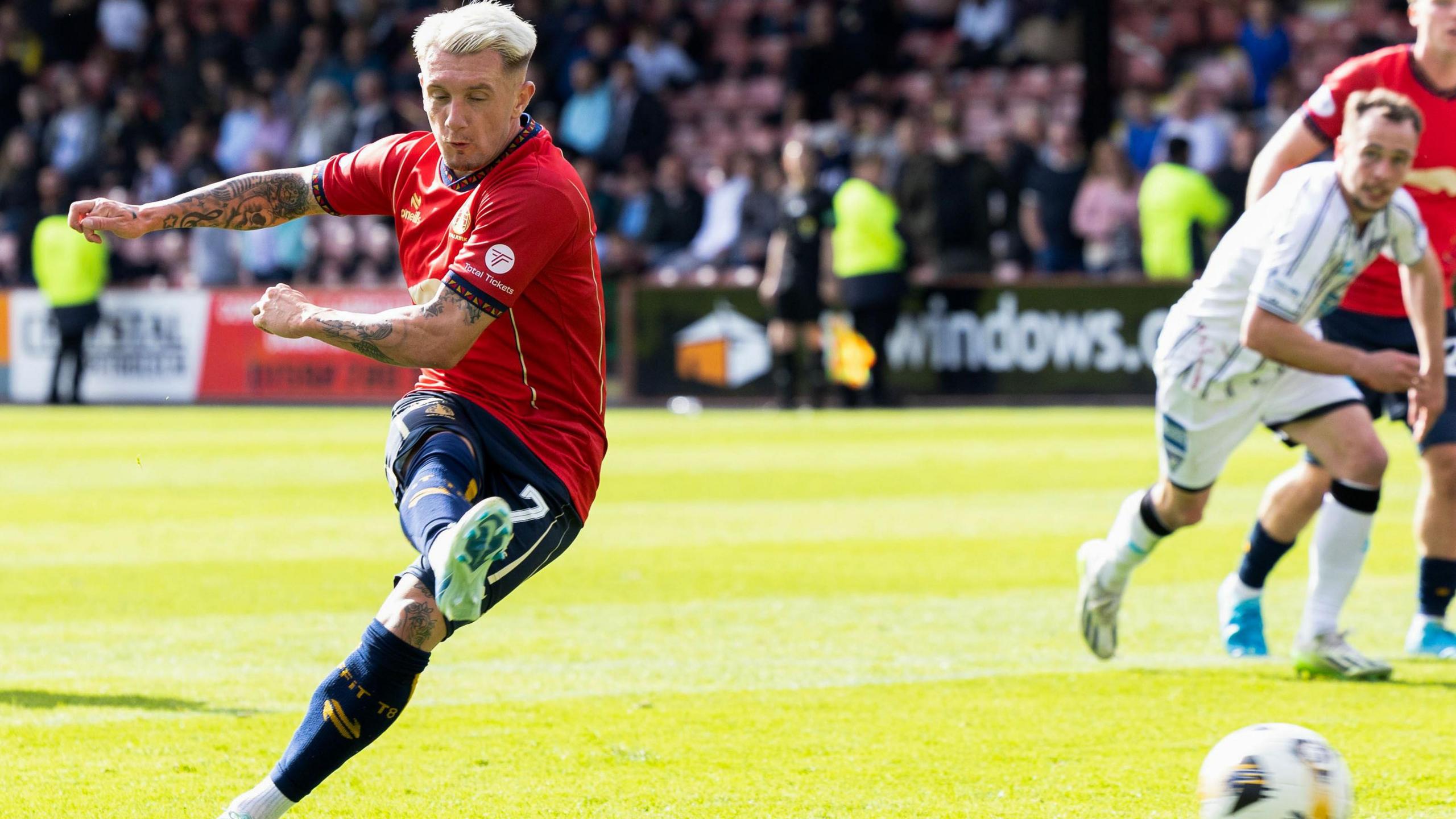 Callumn Morrison scores a penalty for Falkirk against Dunfermline Athletic