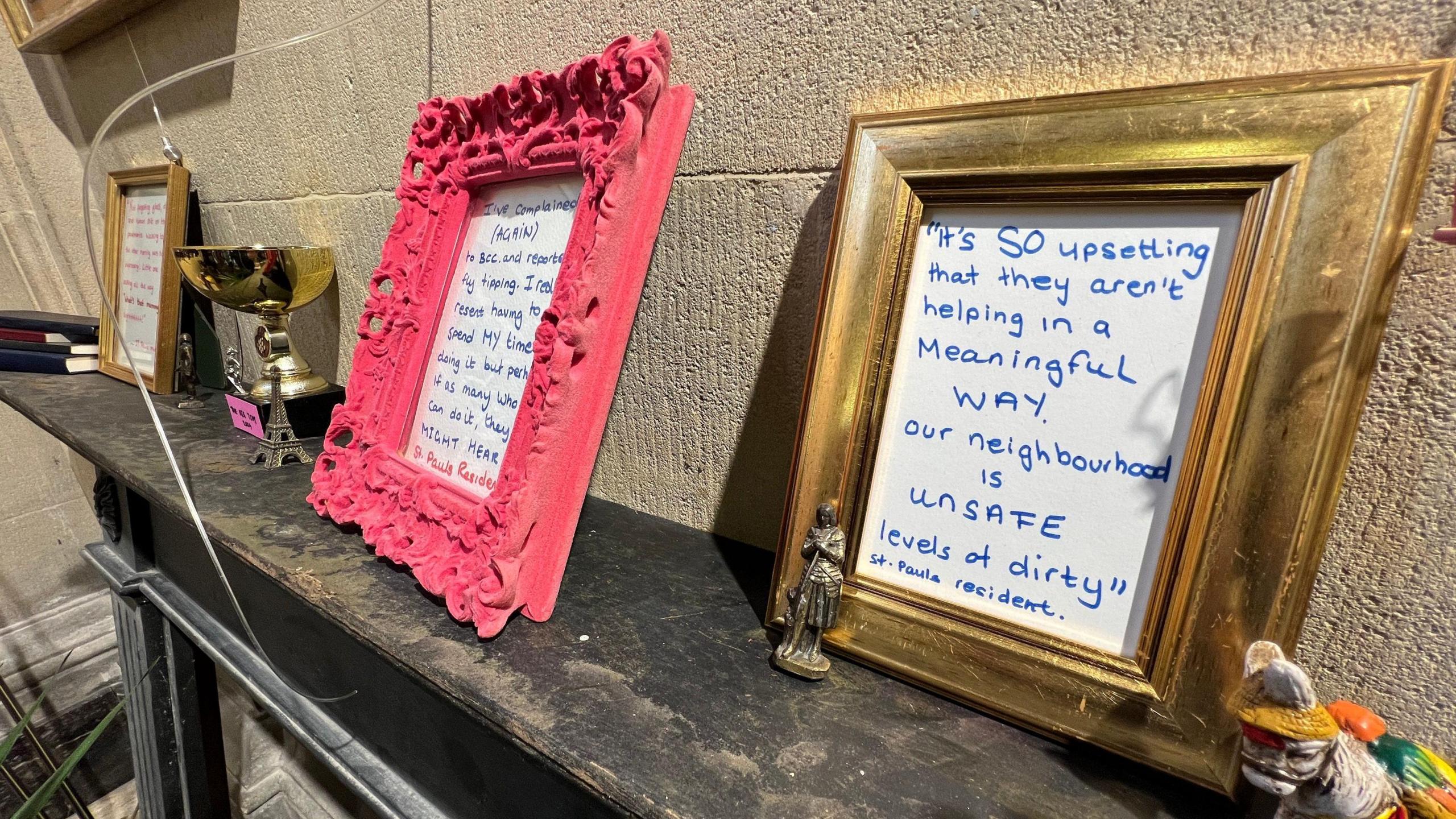 Three photo frames with written quotes from residents. One says "It's so upsetting that they aren't helping in a meaningful way. Our neighbourhood is unsafe levels of dirty."