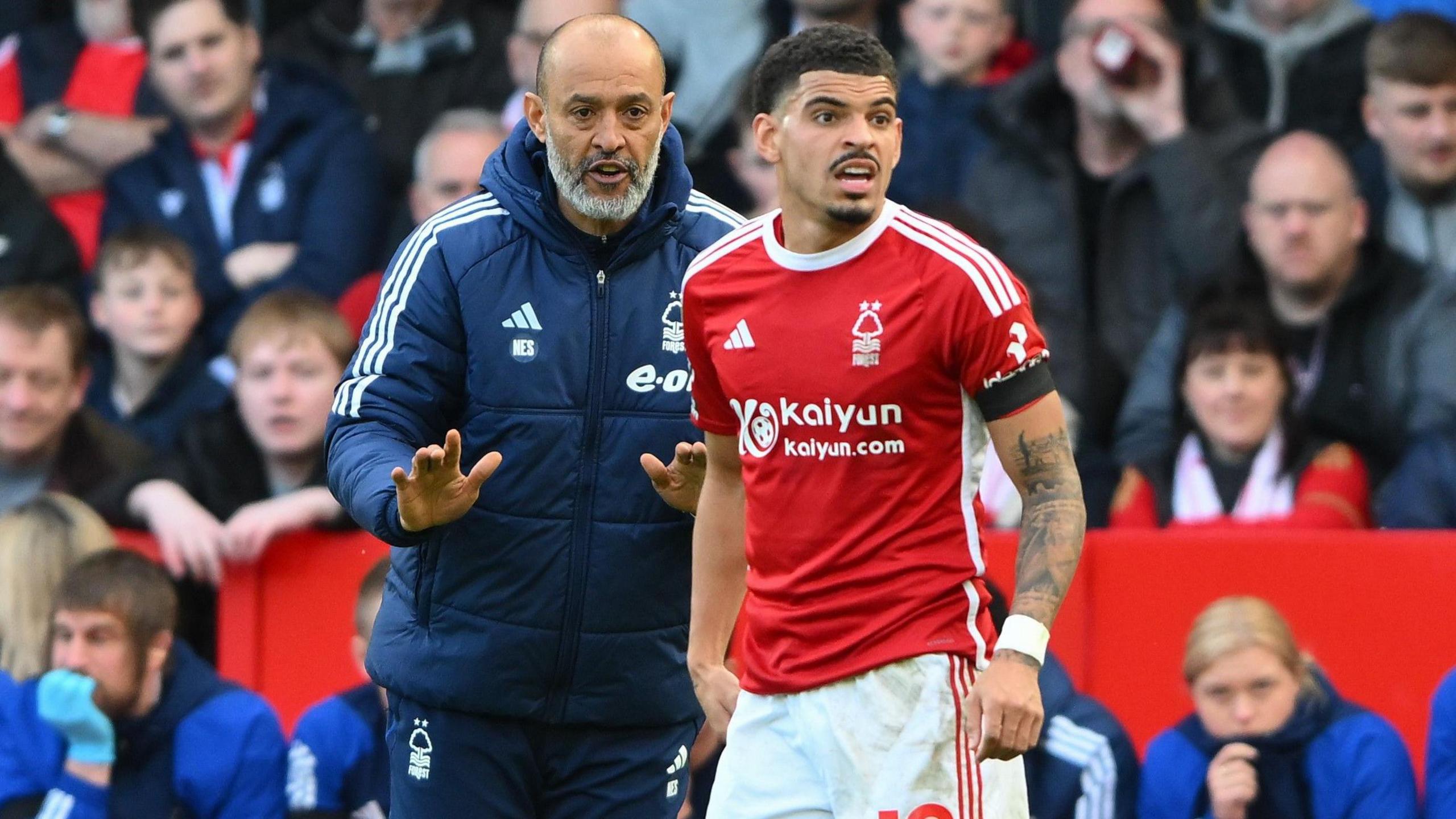 Nuno Espirito Santo and Morgan Gibbs-White talk on the touchline of the City Ground. 